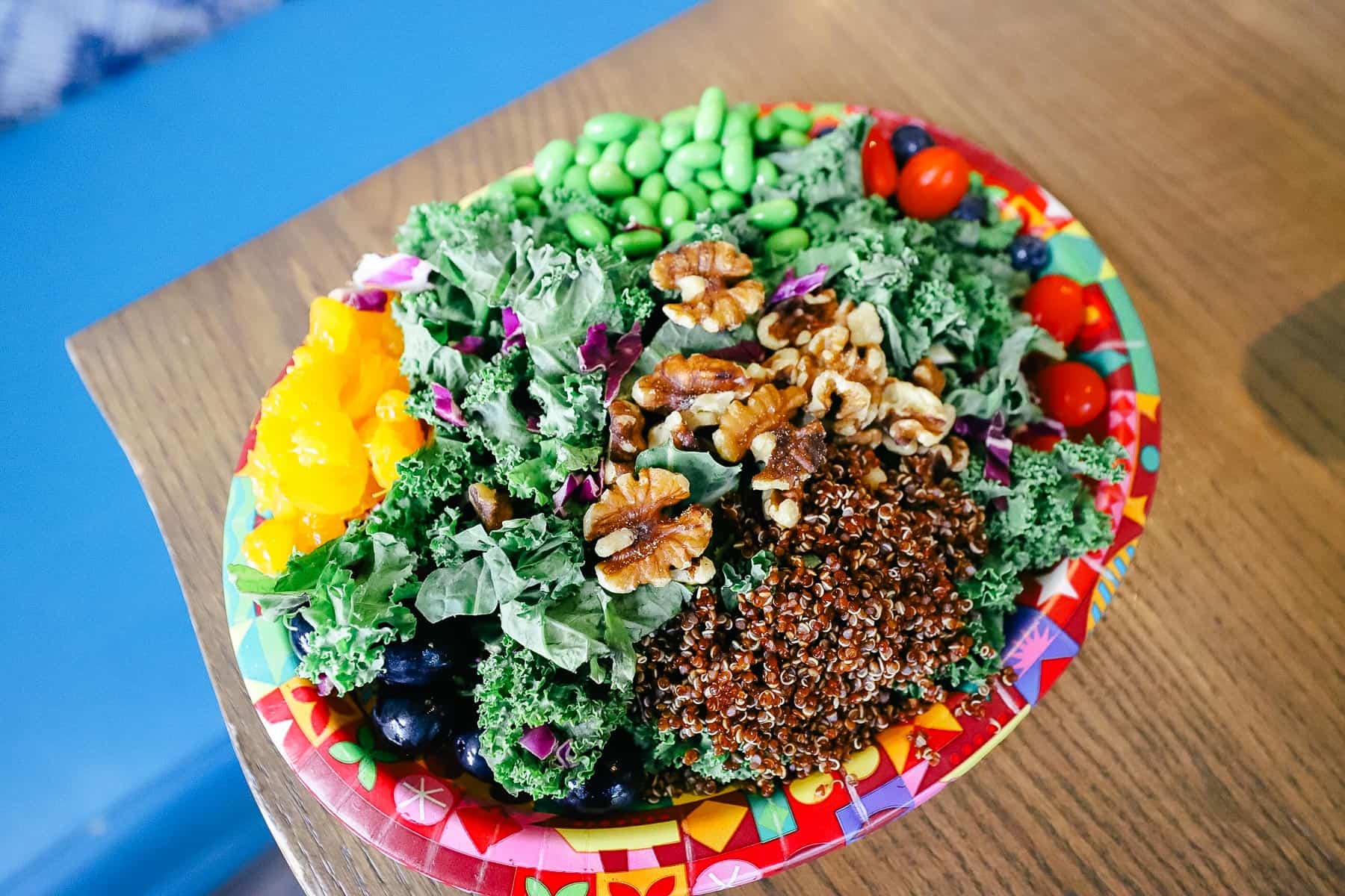 Superfoods Salad: Kale and Cabbage tossed with Quinoa and Edamame, Walnuts, Grapes, Blueberries, and Mandarin Oranges served with a side of Apple Cider Vinagarette
