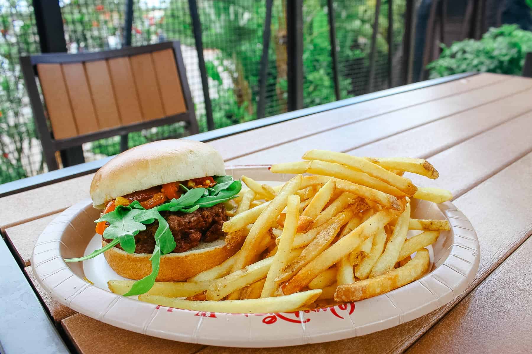 Topped with Arugula and Roasted Red Pepper-Tomato Chutney on a Brioche Bun served with French Fries
