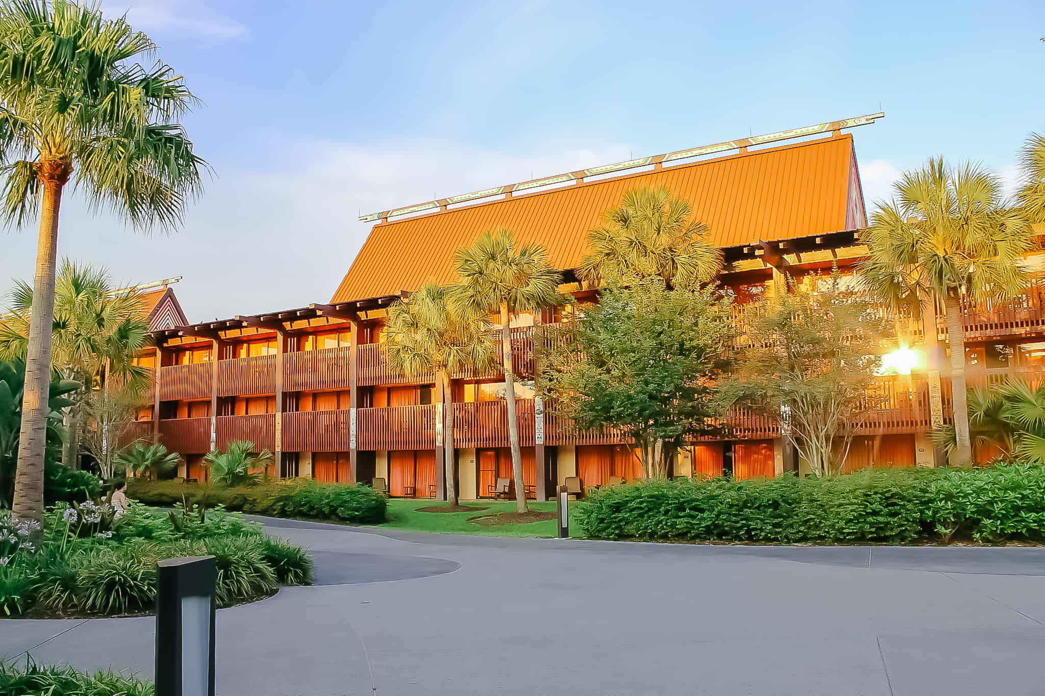 a building at Disney's Polynesian with the sun shining on it late in the afternoon 