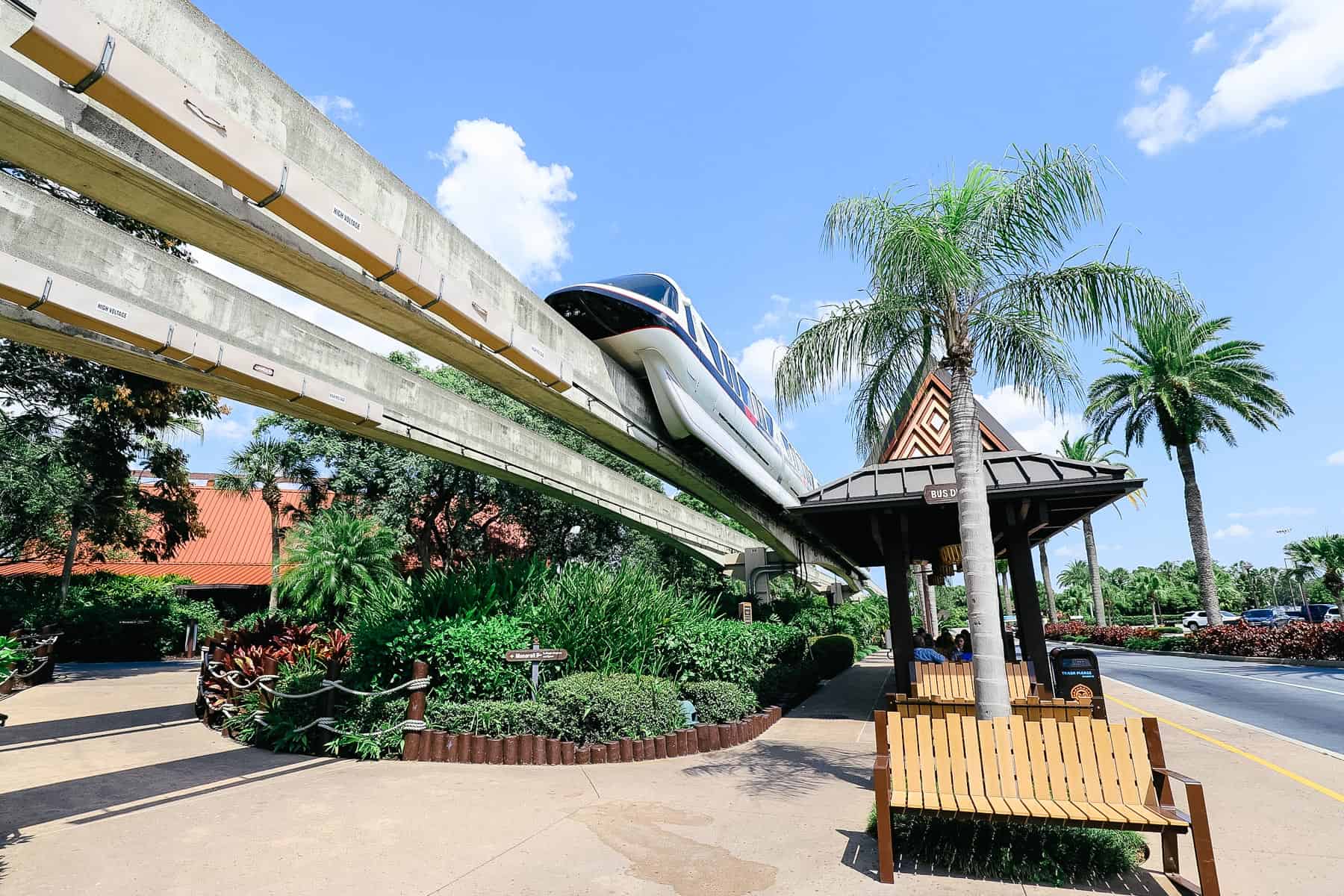 a monorail and bus stop at a Disney Resort 