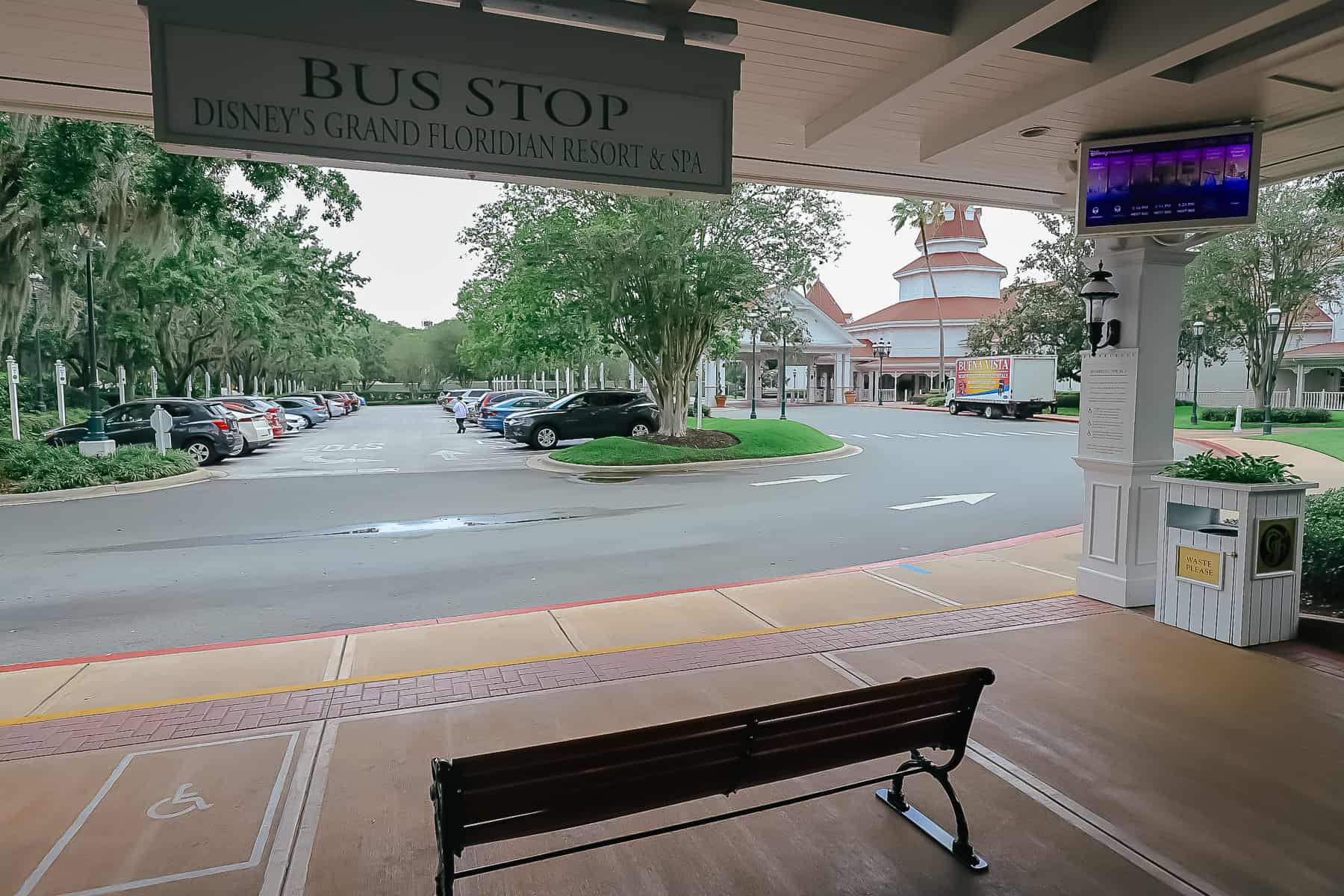 the bus stop with guests waiting for a bus from Grand Floridian to Animal Kingdom 