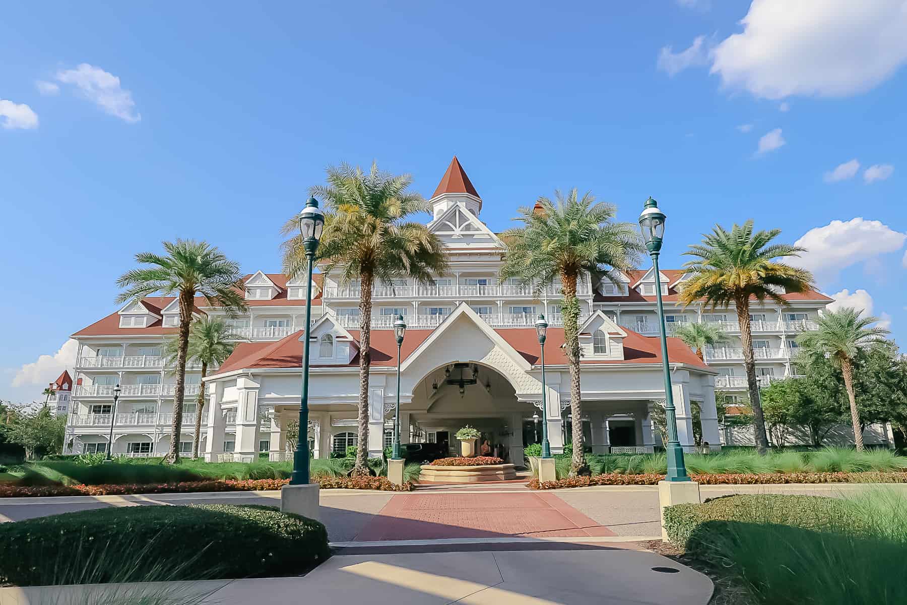 Grand Floridian Villas building with palm trees in front of it 