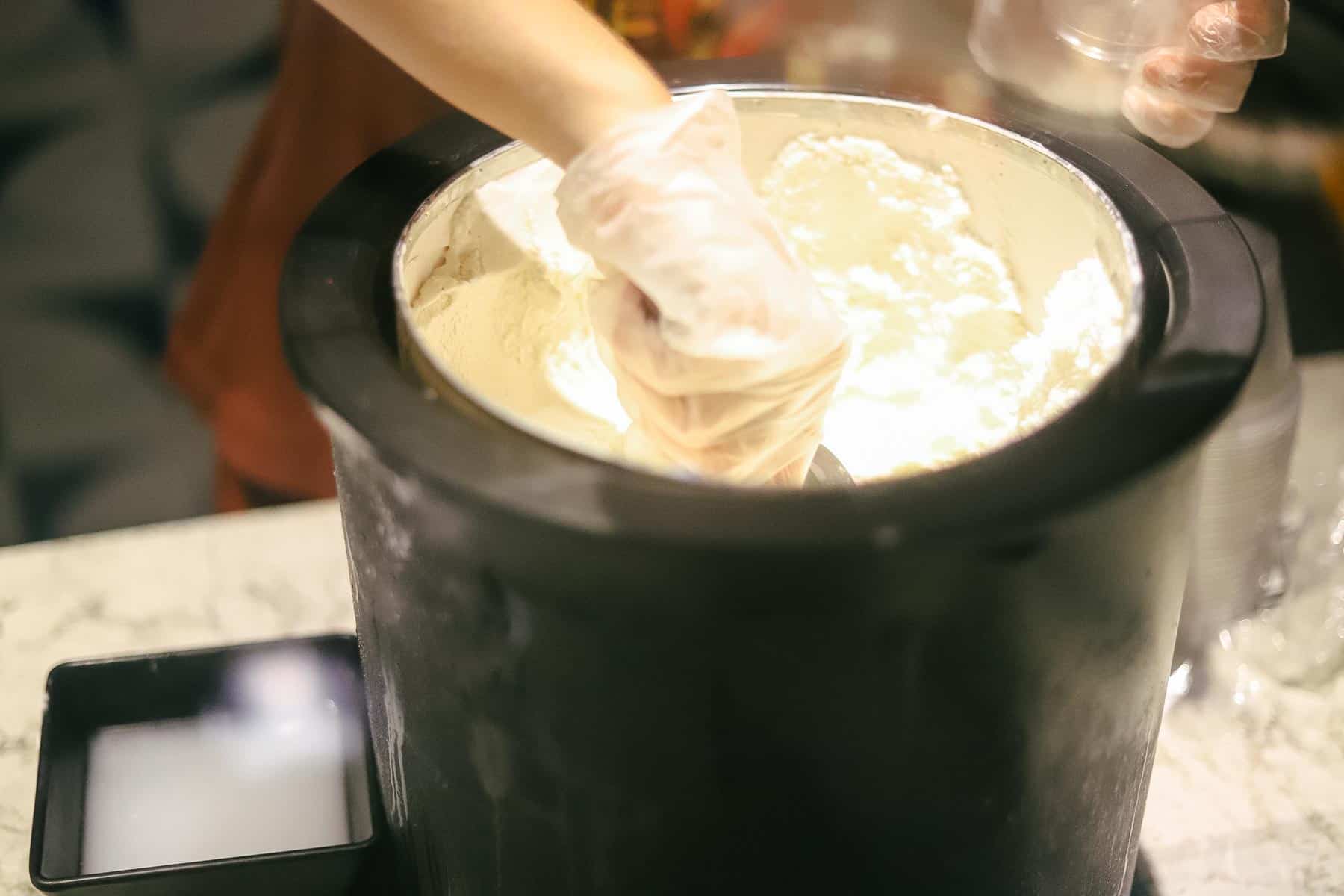 Cast member scooping ice cream 