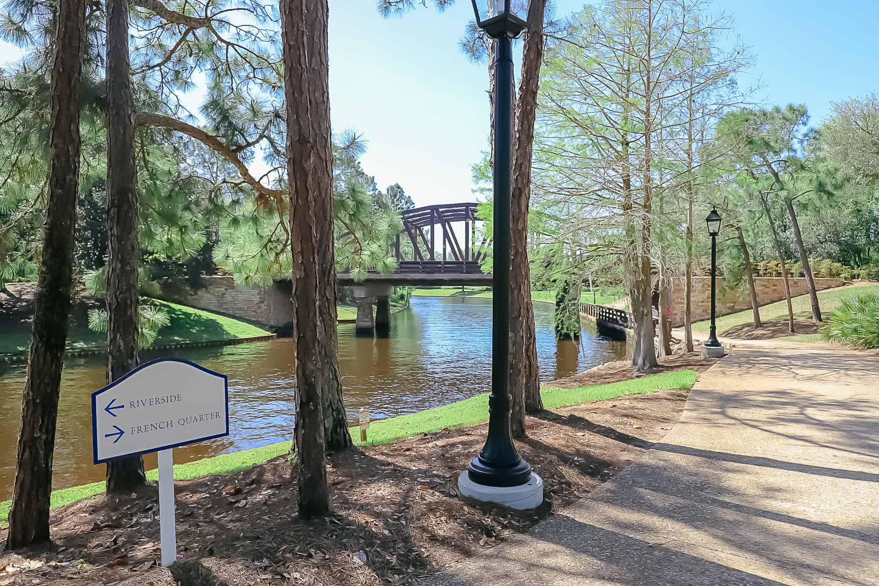 the walkway between Port Orleans Riverside and French Quarter with a directional between them 