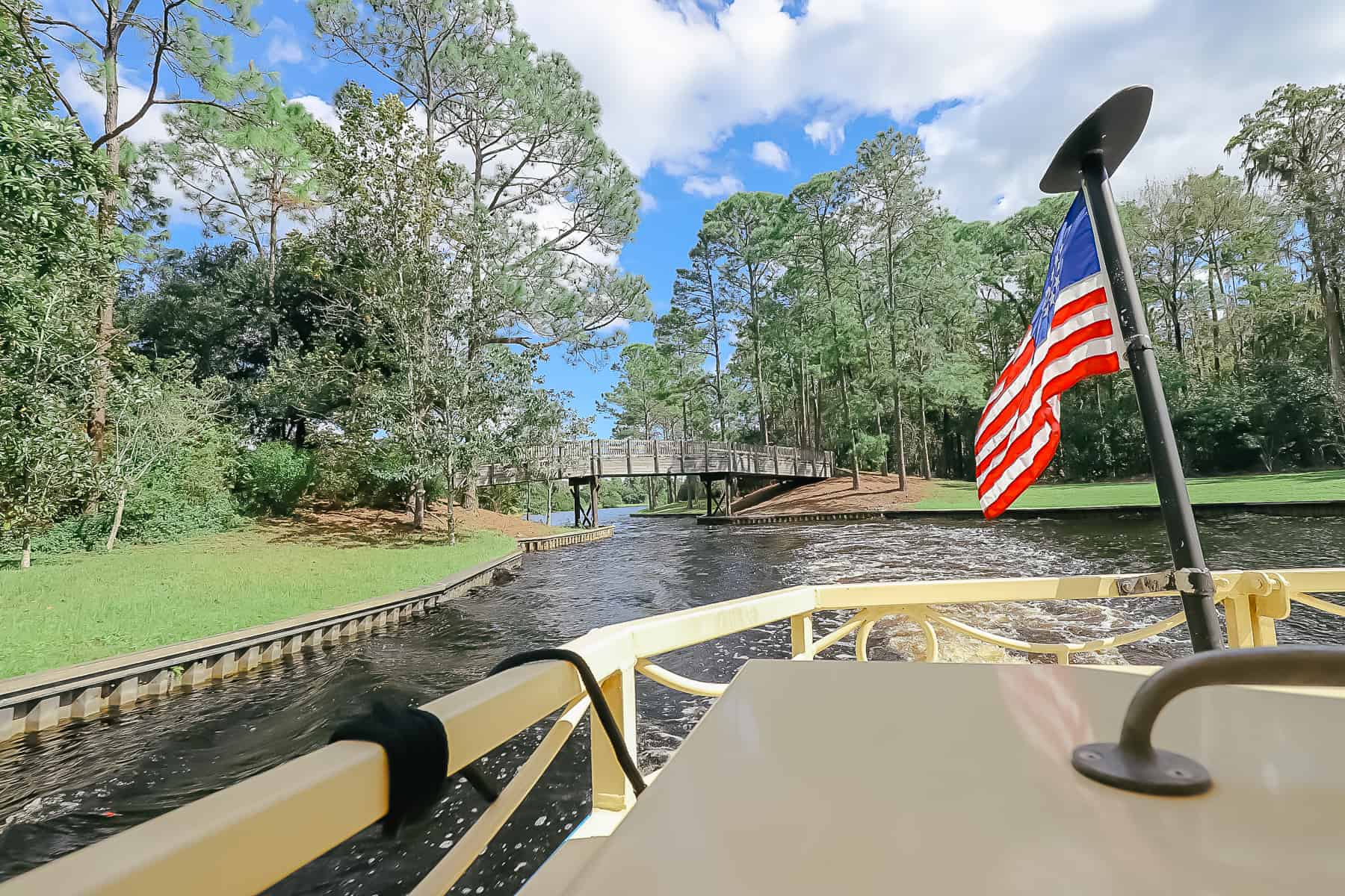 an American flag on the back of a water taxi as it heads down the Sassagoula River toward Port Orleans Riverside 