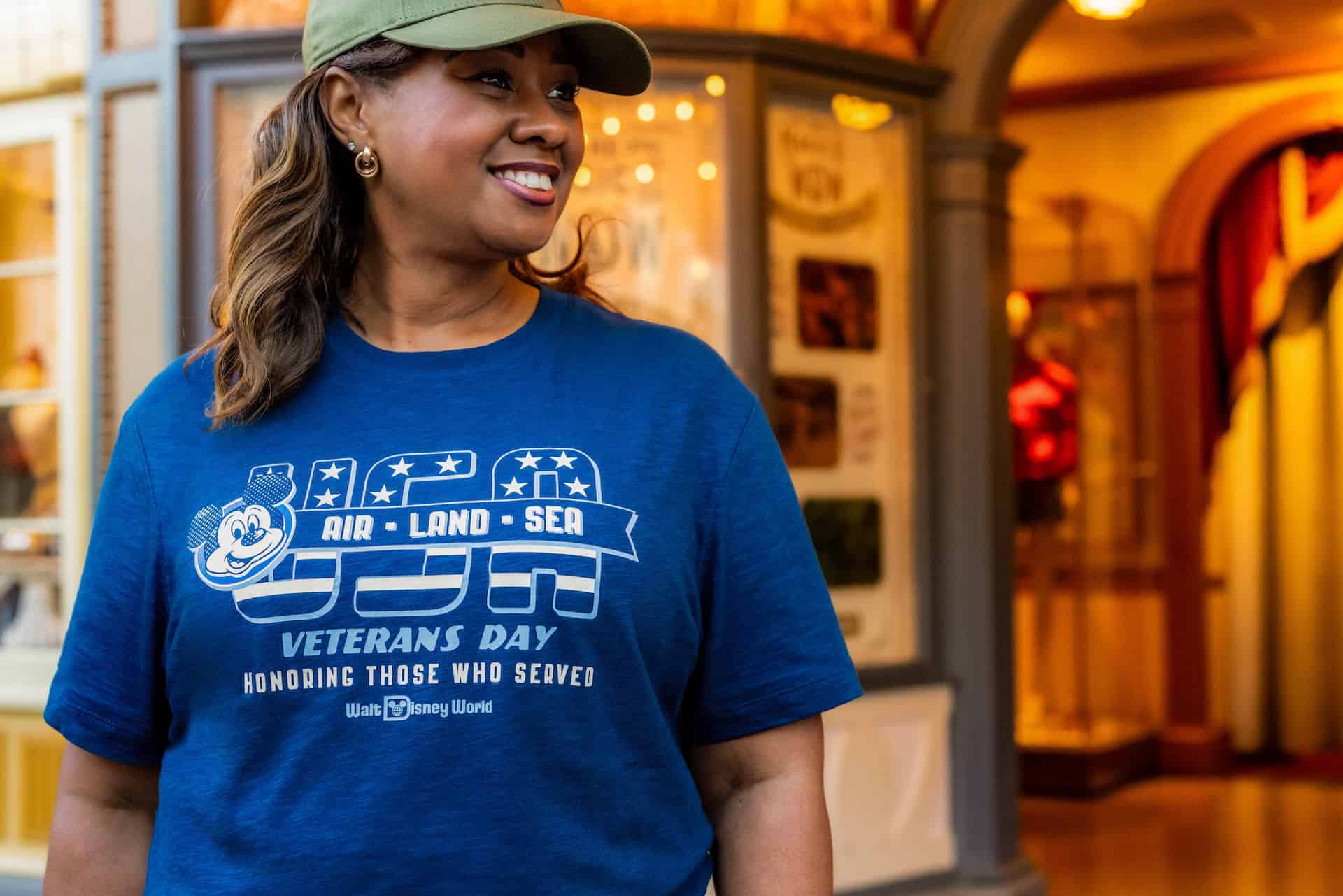 a model wearing a blue USA Air, Land, and Sea t-shirt 