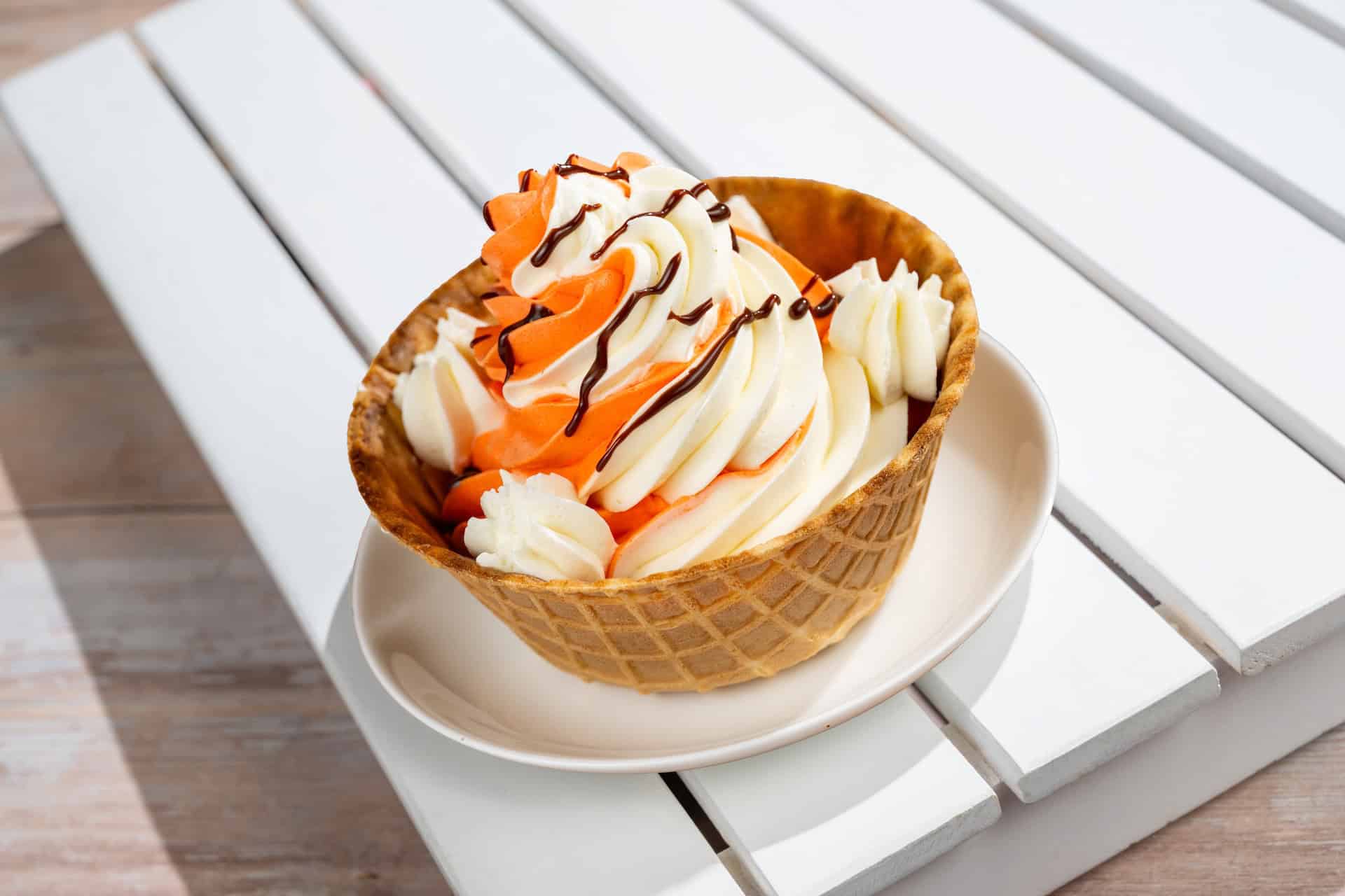 a Dole Whip and soft serve swirl with chocolate sauce