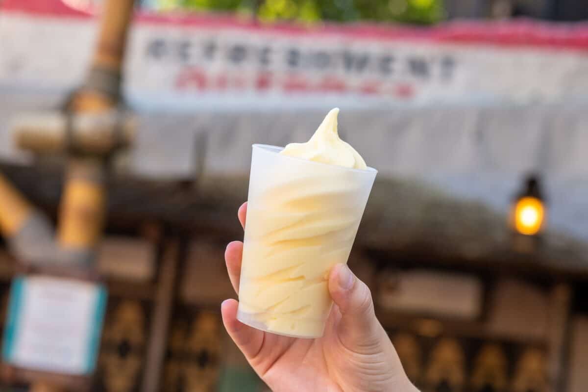 a hand holding up a Dole Whip