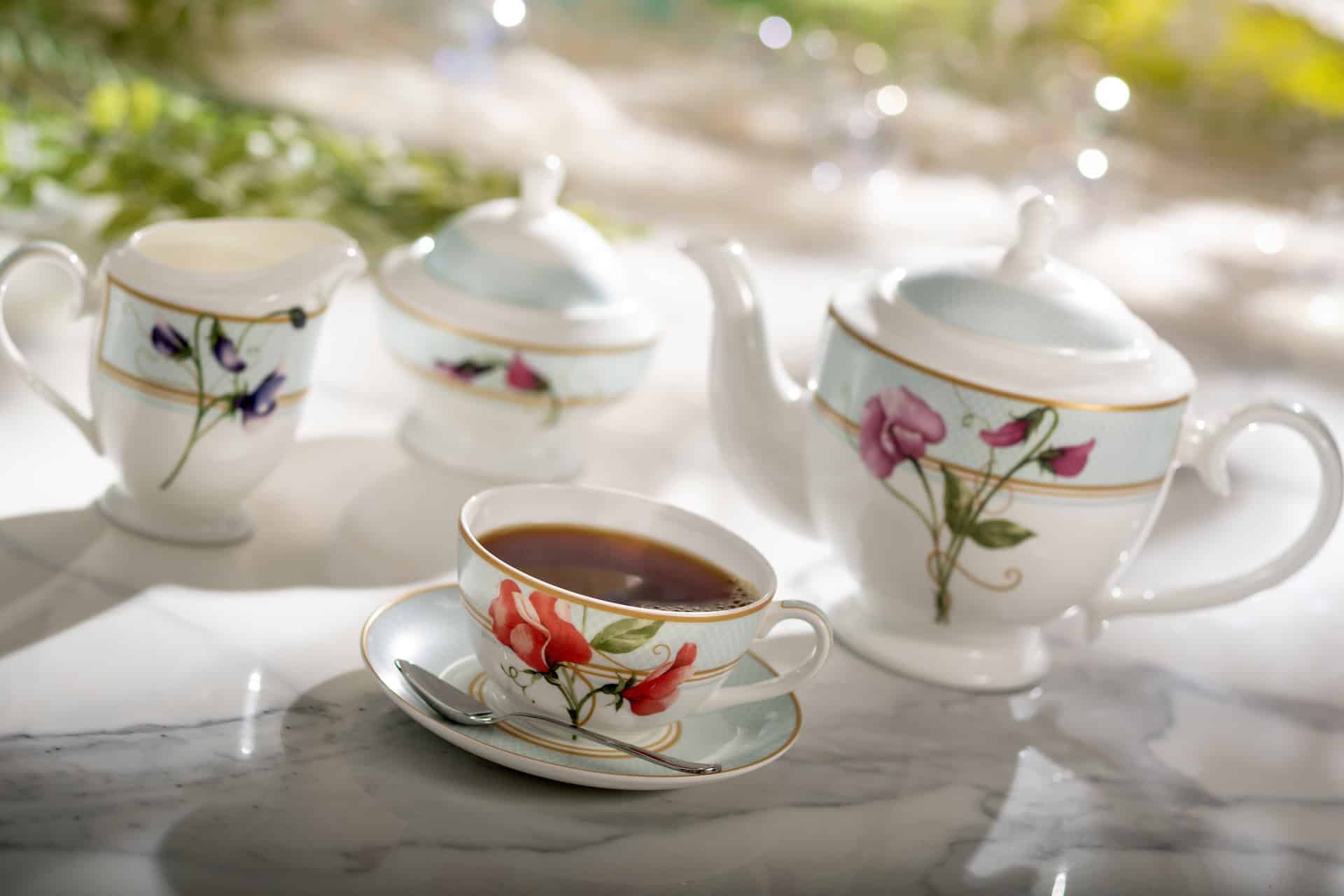 a set of tea with cups and saucers