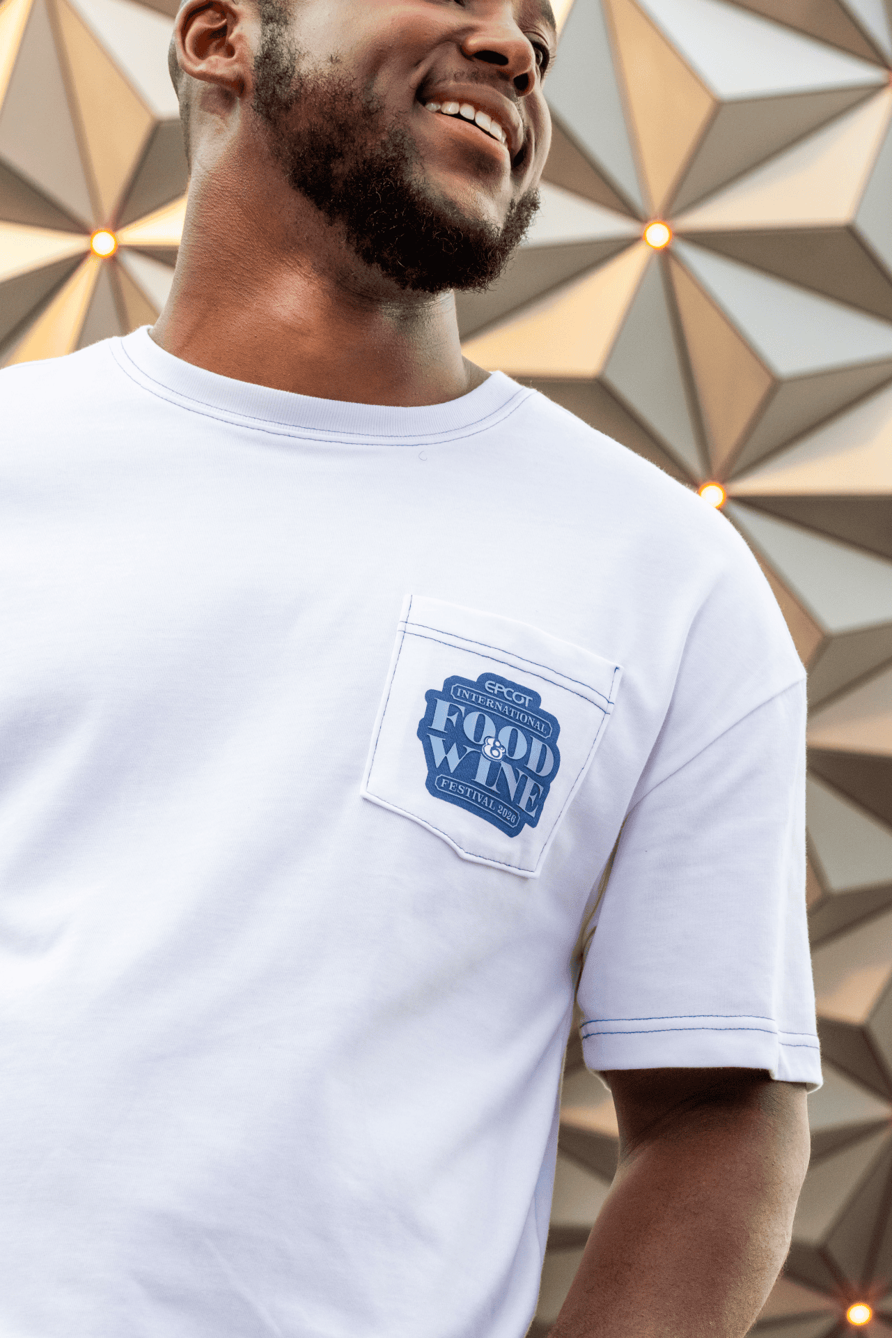 closeup of Food and Wine logo on front pocket of a t-shirt