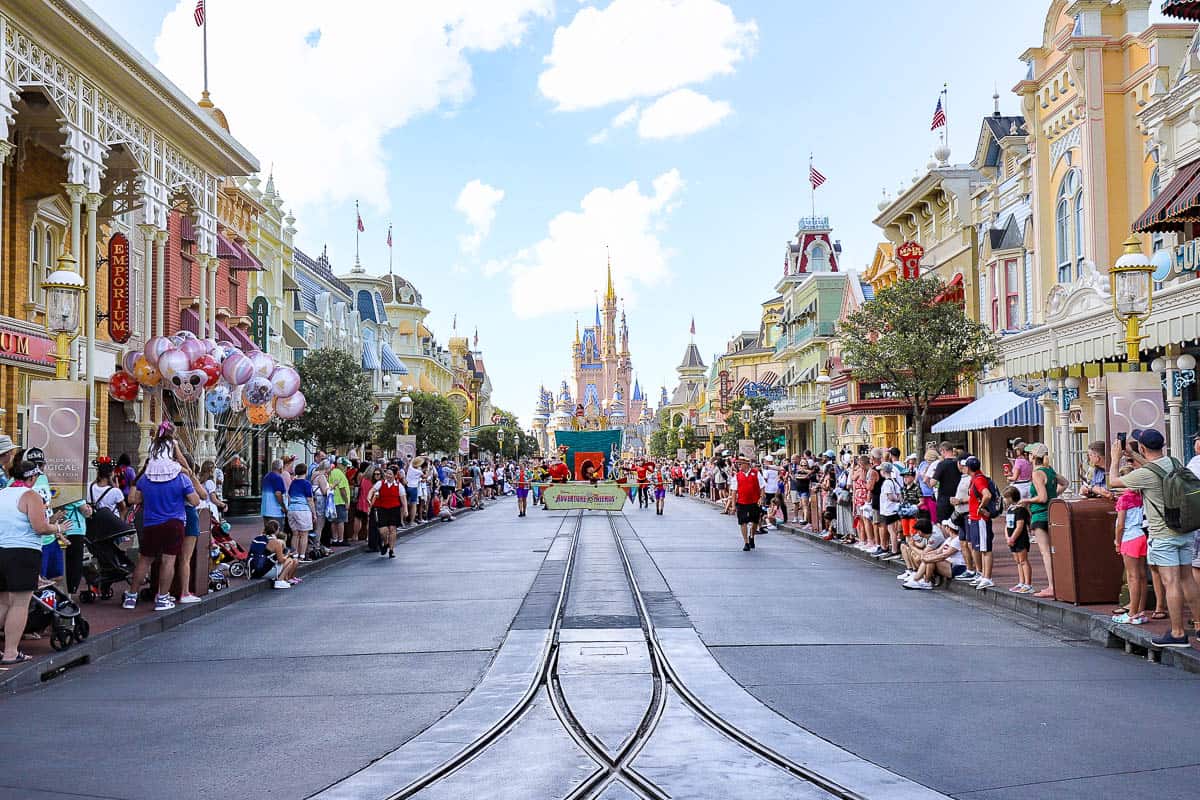 Cinderella Castle in the background as the Adventure Friend Cavalcade starts down Main Street.