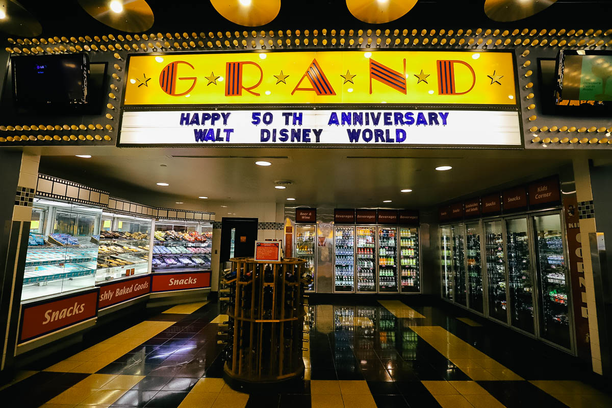 a small store at the back of the All-Star Movies food court with a sign that says Grand 