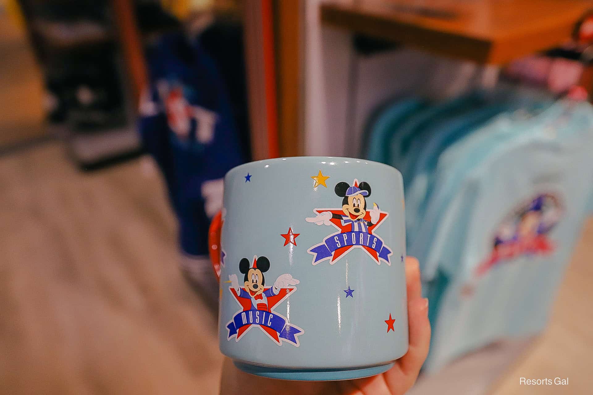 Mickey Mouse represents All-Star Music and Sports on the coffee mug 