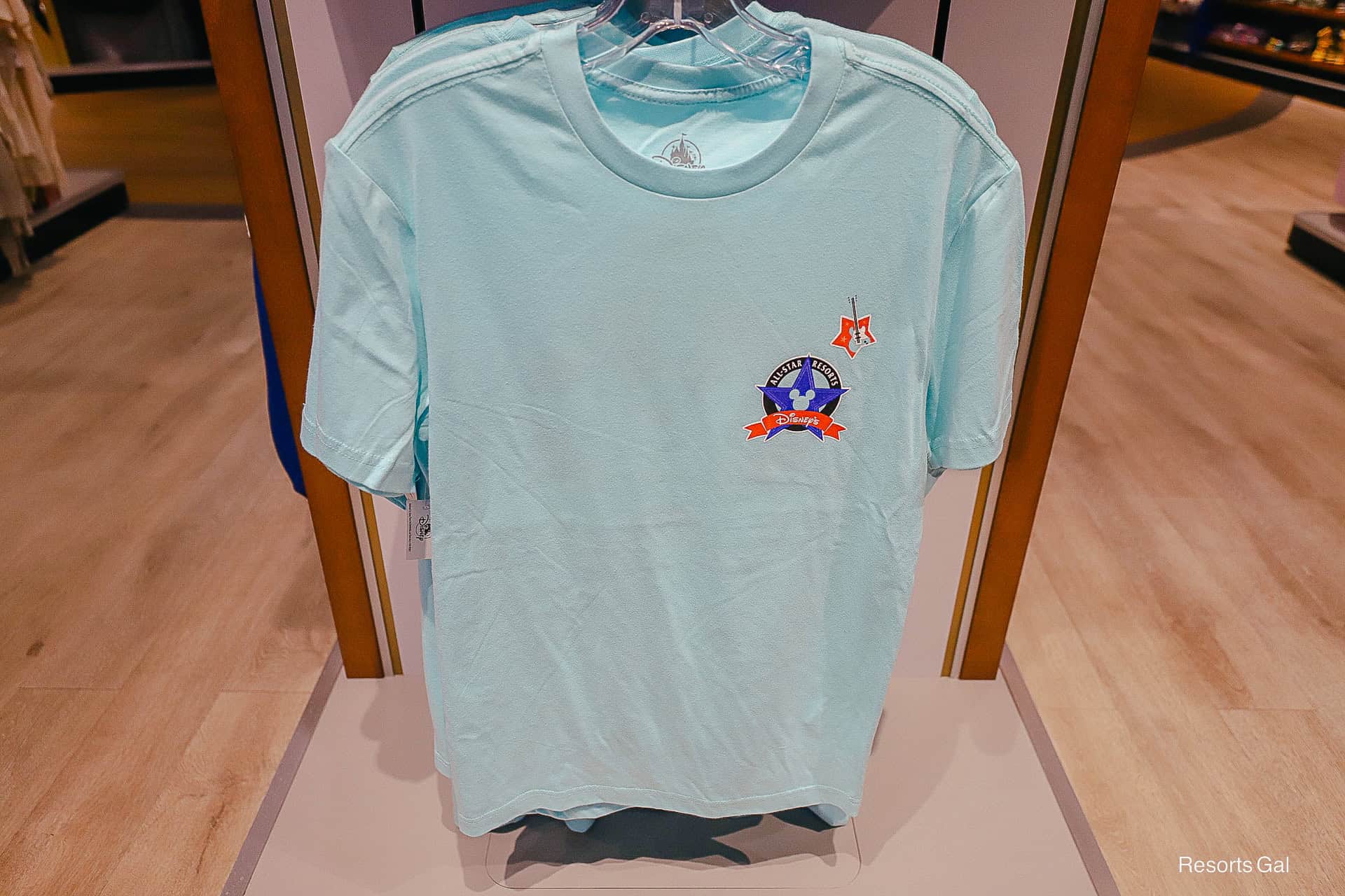 front of an All-Star Music Resort T-shirt 