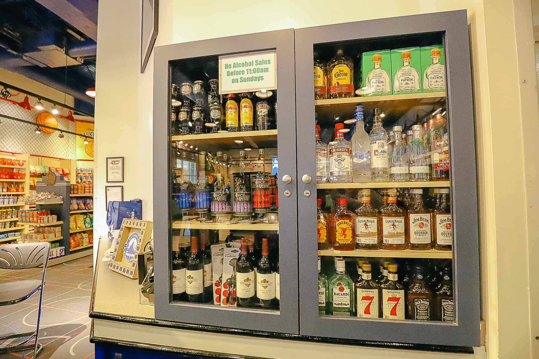 a liquor case behind the register at All-Star Sports Gift Shop 
