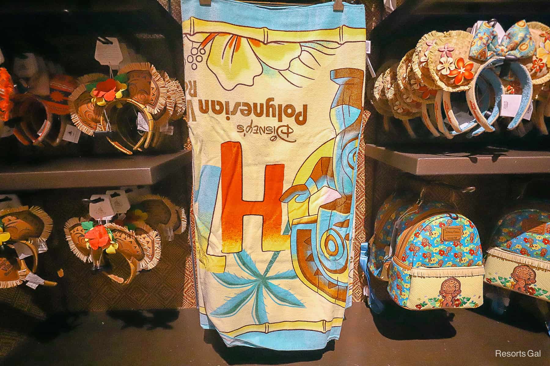 a beach towel branded to the Polynesian Resort 