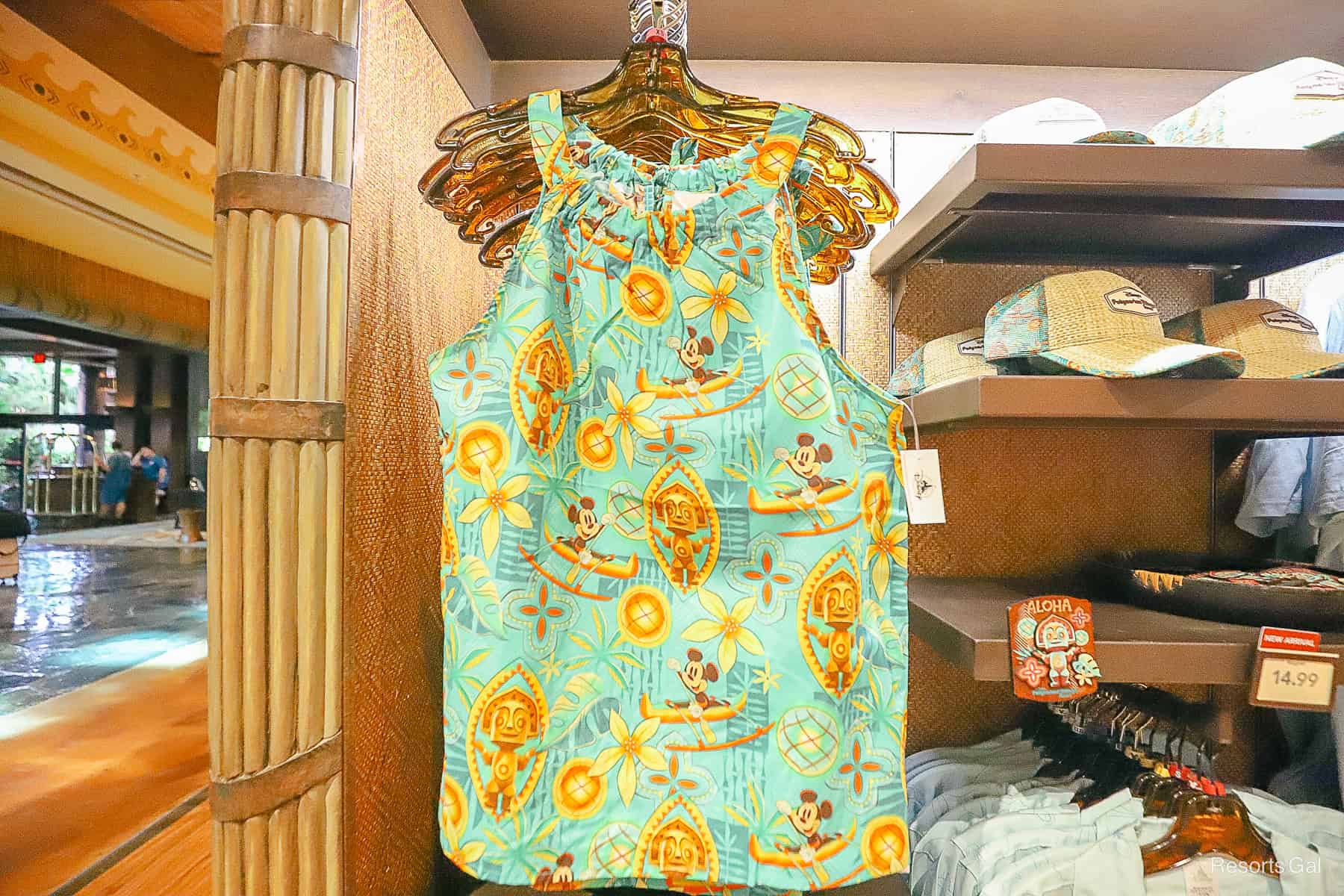 a sleeveless bouse with Mickey Mouse in a tropical design 