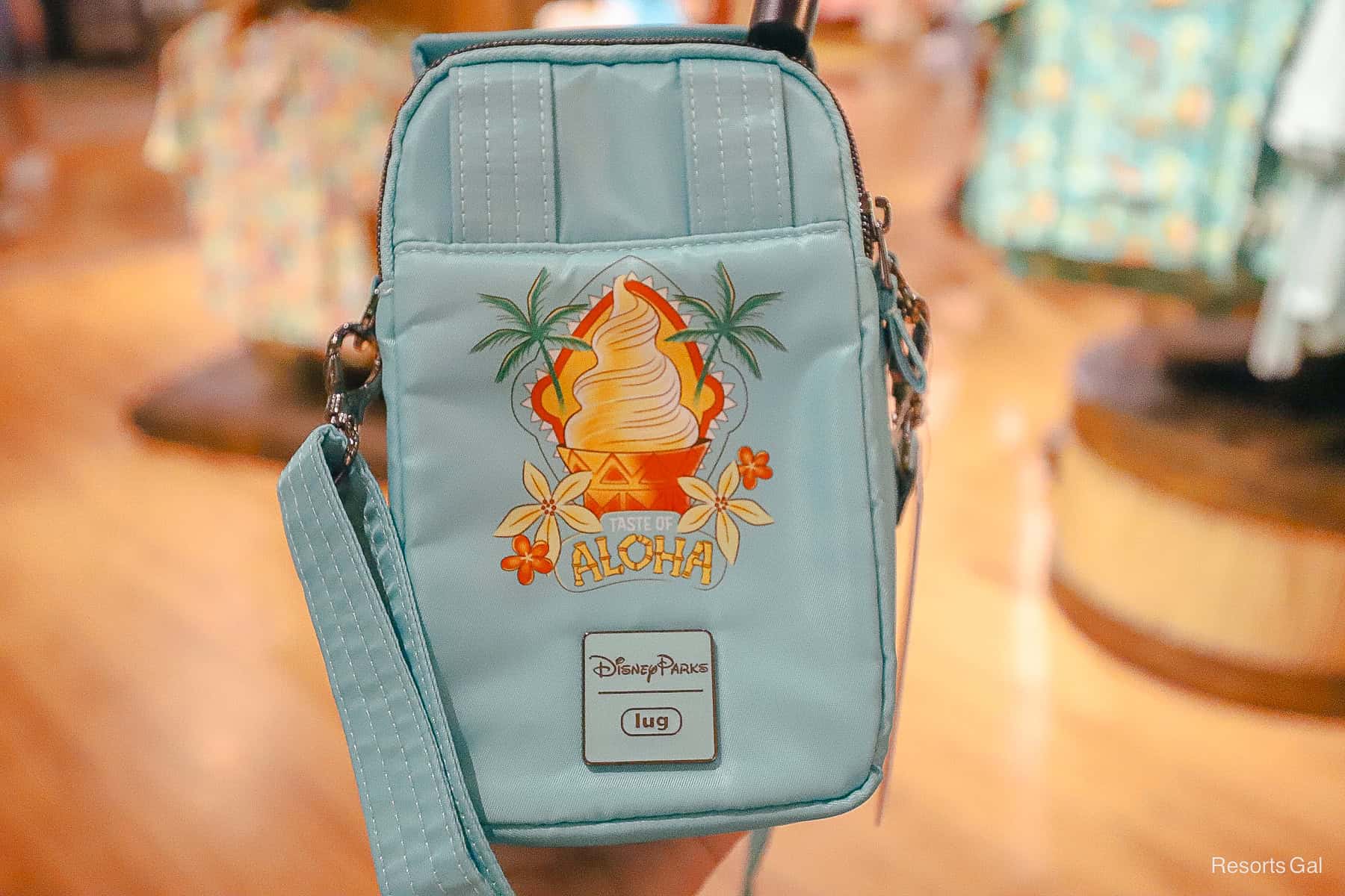 the backside of the Disney Parks Aloha lug bag with a Dole Whipe 