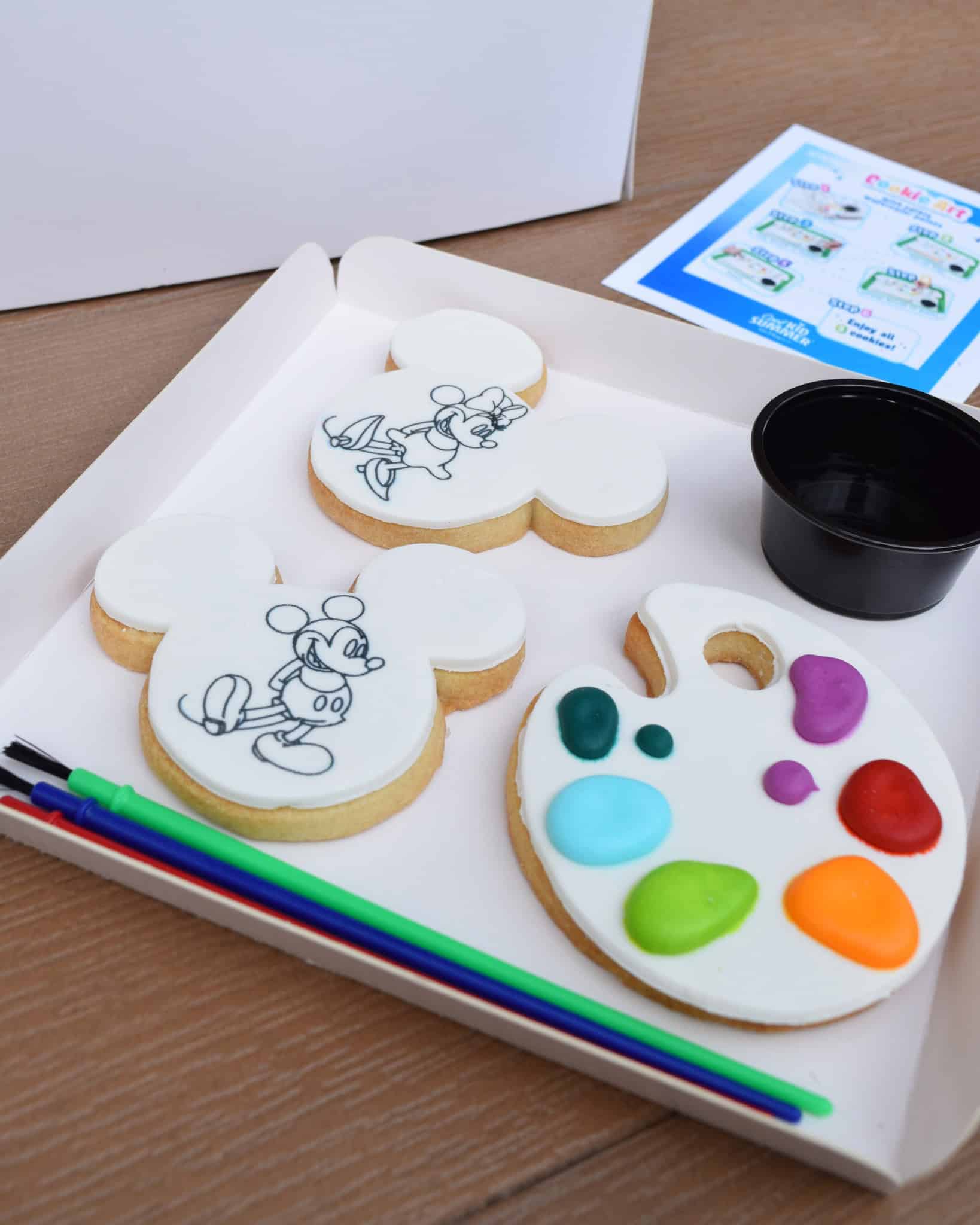 the Mickey and Minnie Cookie with a third cookie featuring droplets of edible water color paint