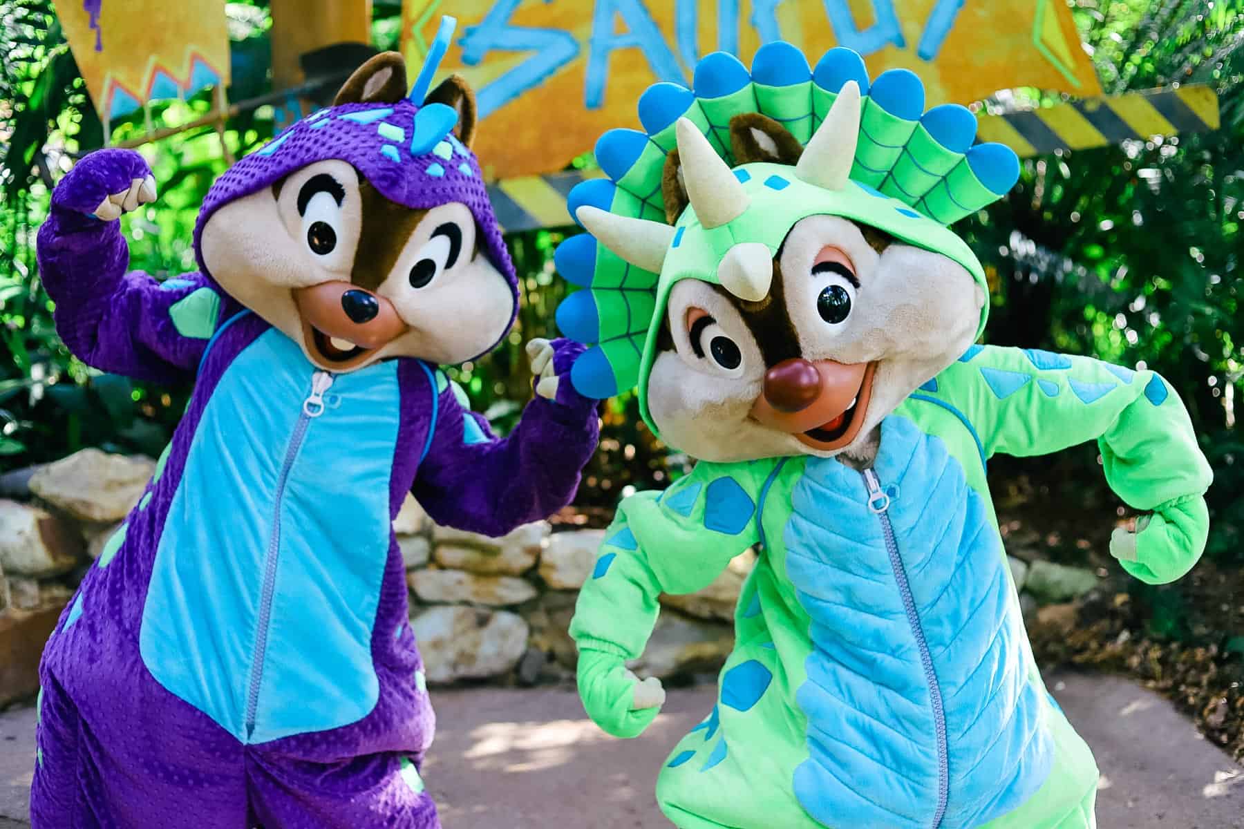 Chip and Dale in dinosaur costumes 