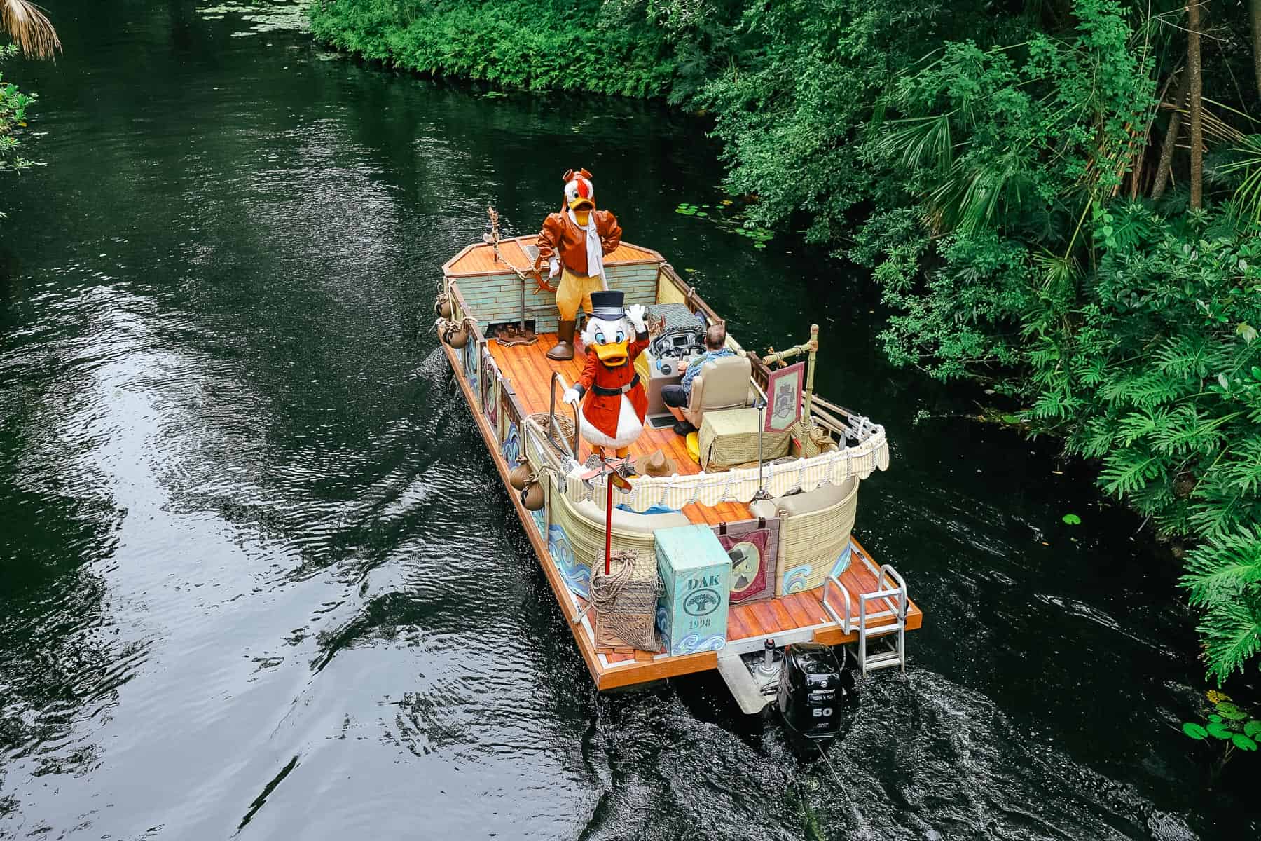 Scrooge McDuck and Launchpad McQuack on a river cruise. 