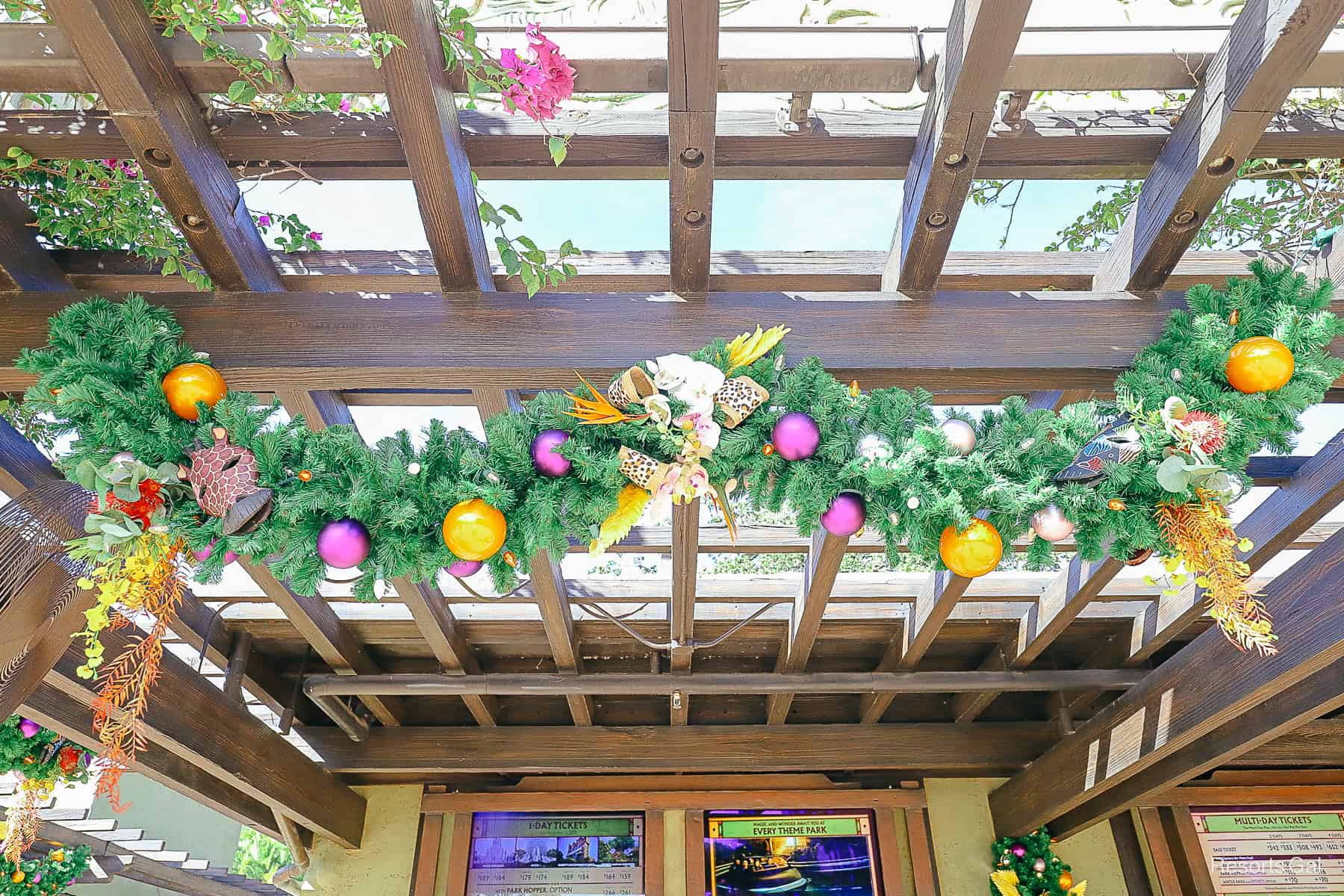 a centered strand of garland with florals and an animal print ribbon