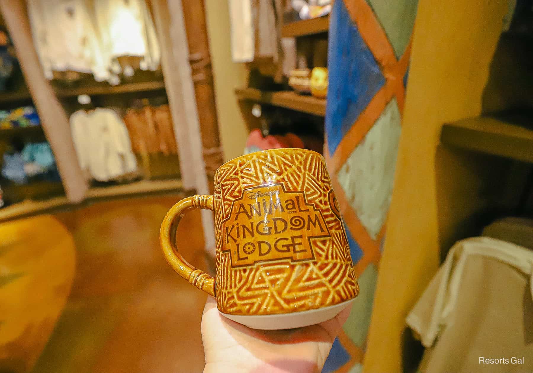 a coffee mug with Disney's Animal Kingdom Lodge resort logo 