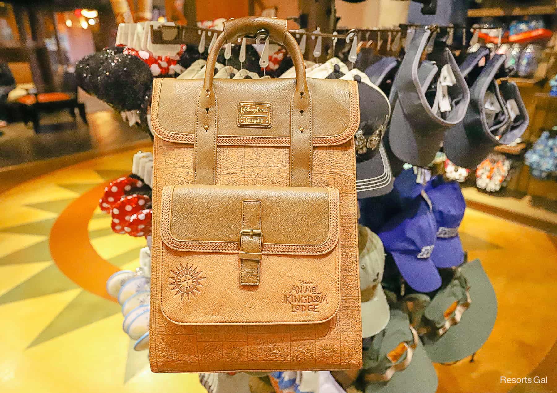 an oversized Disney Parks Loungefly with the resort's logo 