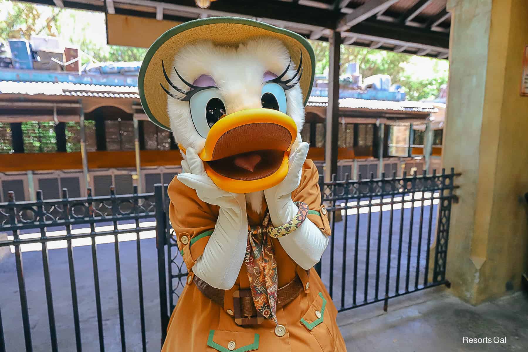 Daisy Duck with hands on cheeks at temporary character location. 