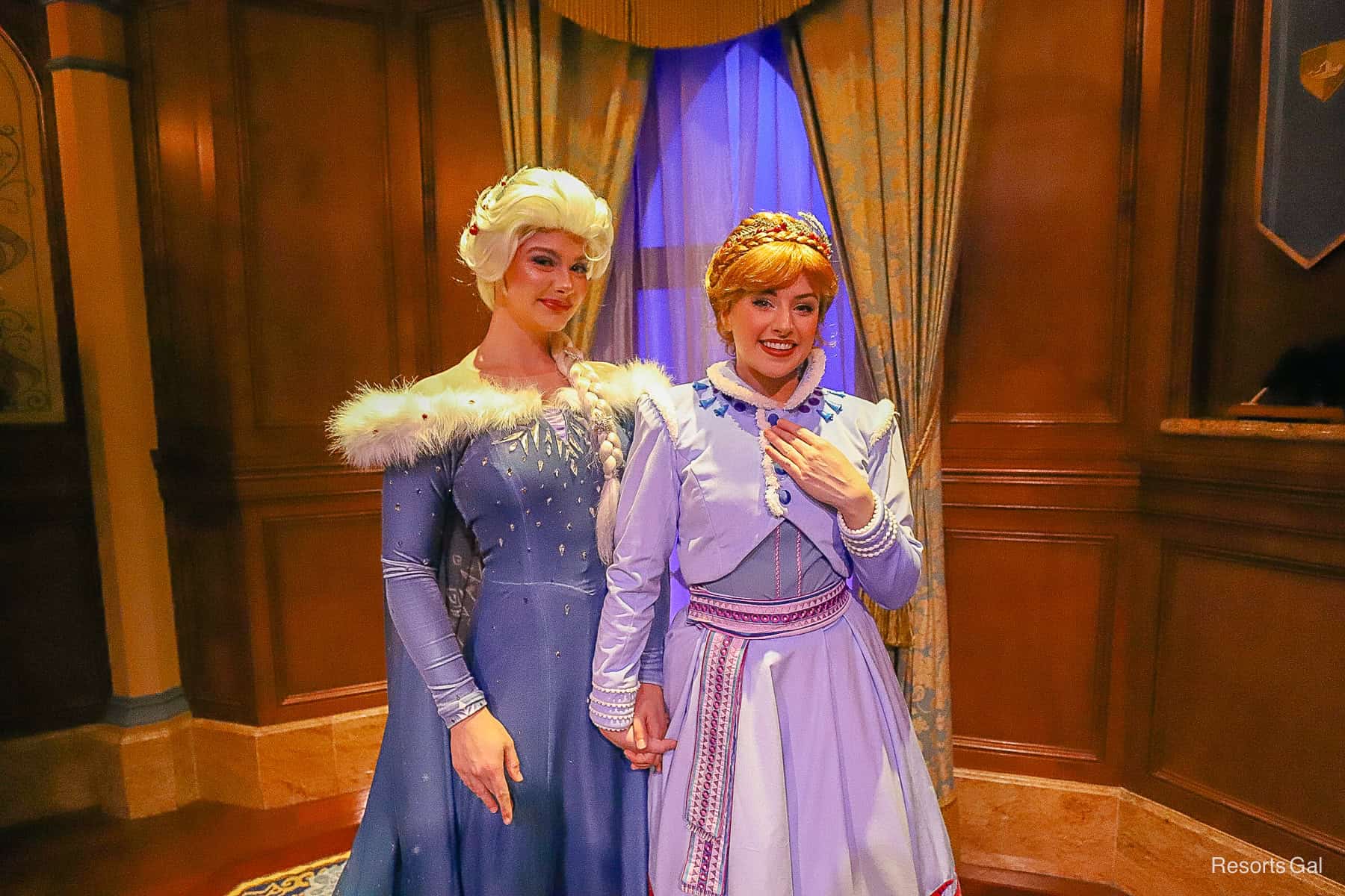 Anna and Elsa smile for the camera. 