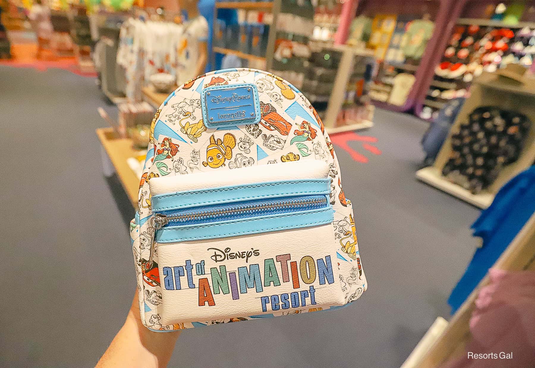 a Loungefly backpack with Disney's Art of Animation on it 