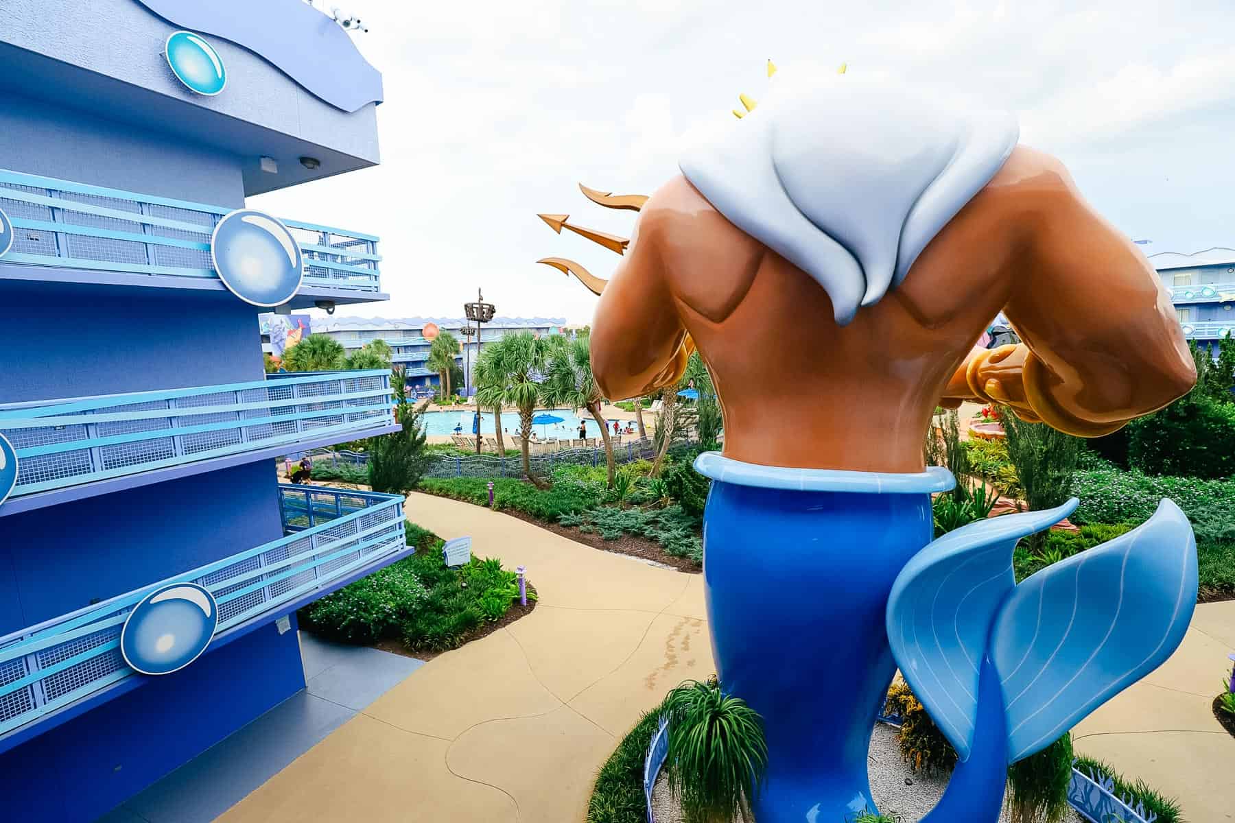 the back of King Triton as he looks over The Little Mermaid section 