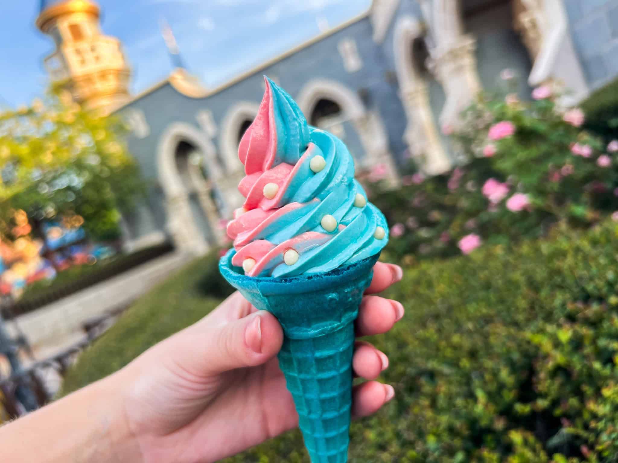 a cone with pink and blue swirls soft serve 