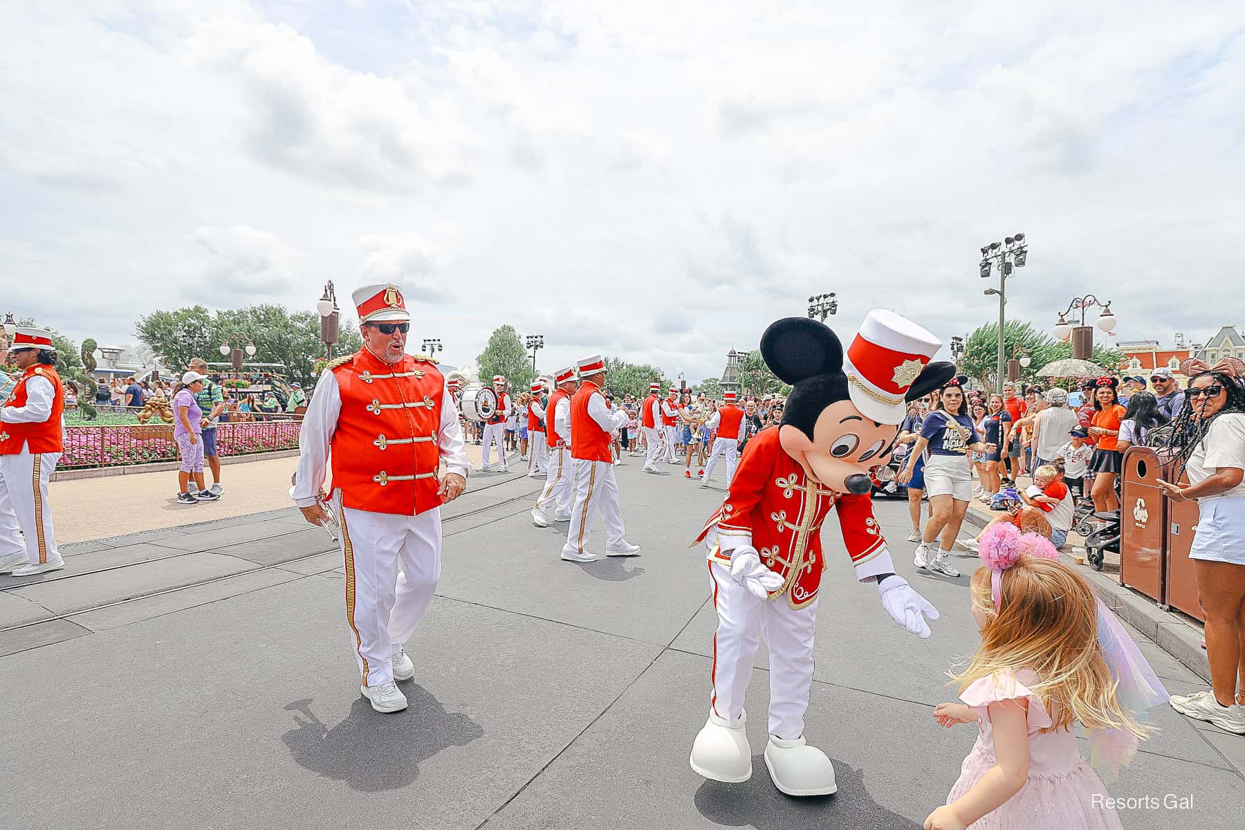 band leader Mickey hugs a young guest in the crowd