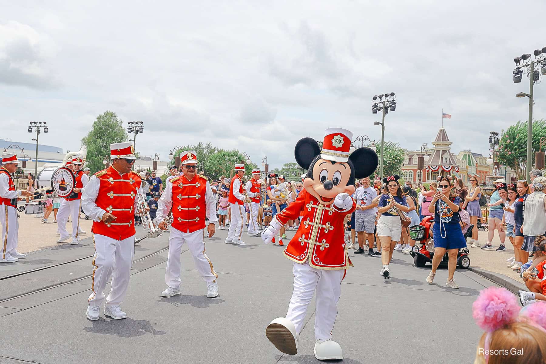 Mickey points to someone in the crowd
