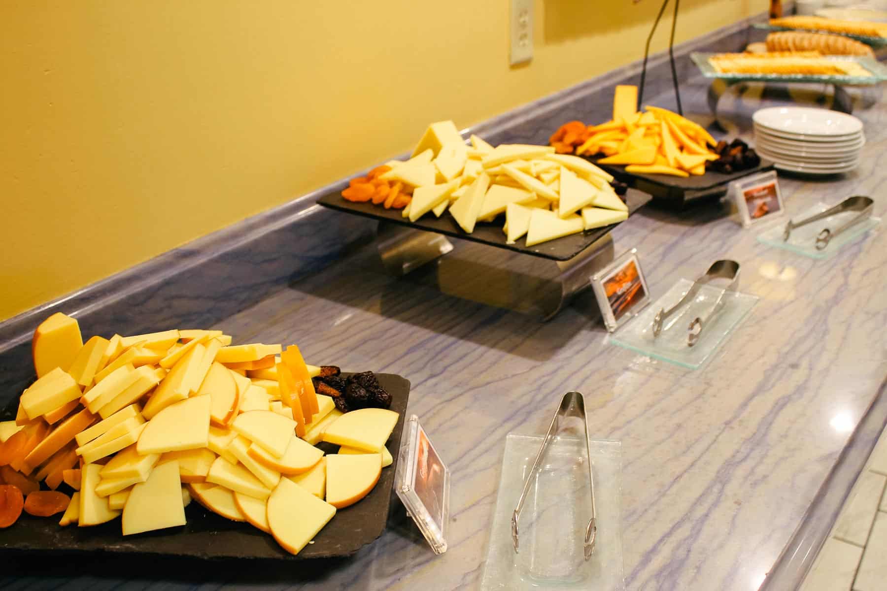 trays with cheese, figs, and dried apricots 