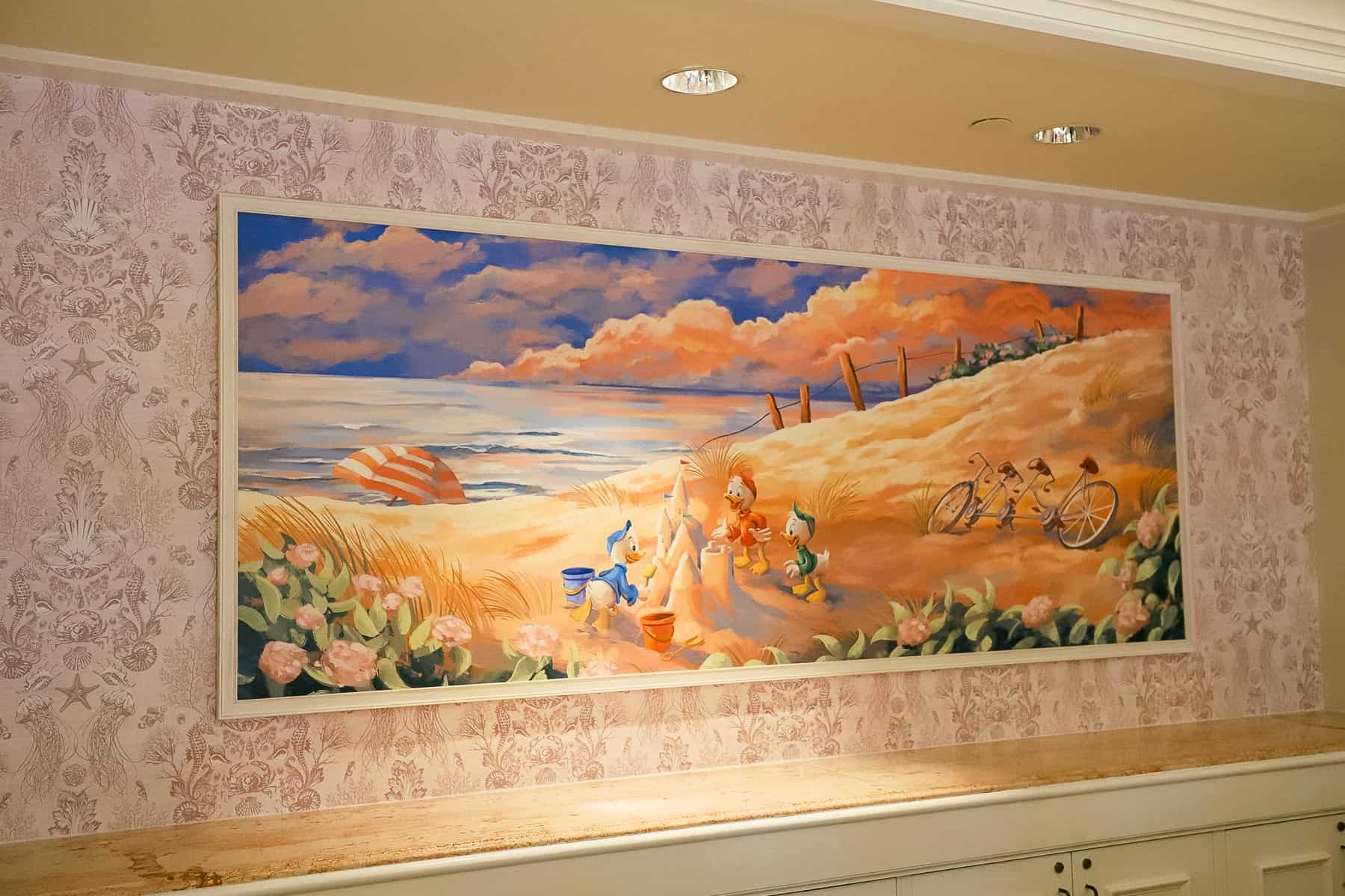 artwork that features Huey, Dewey, and Louie building a sandcastle on a beach near the check-in area of Disney's Beach Club 