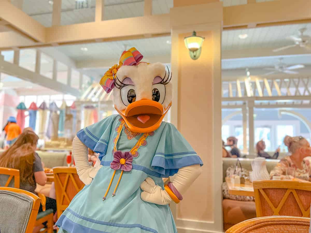 Daisy Duck wearing a blue dress at Minnie's Beach Bash. 