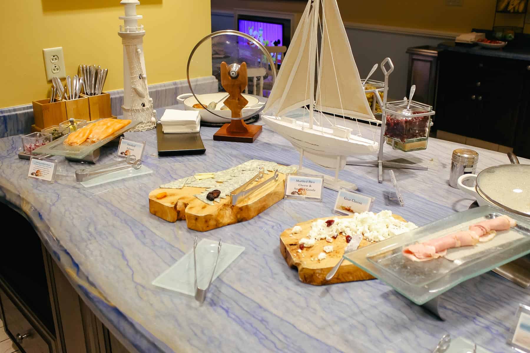 platters with various cheese, smoked salmon, and ham for breakfast in the Stone Harbor Club 