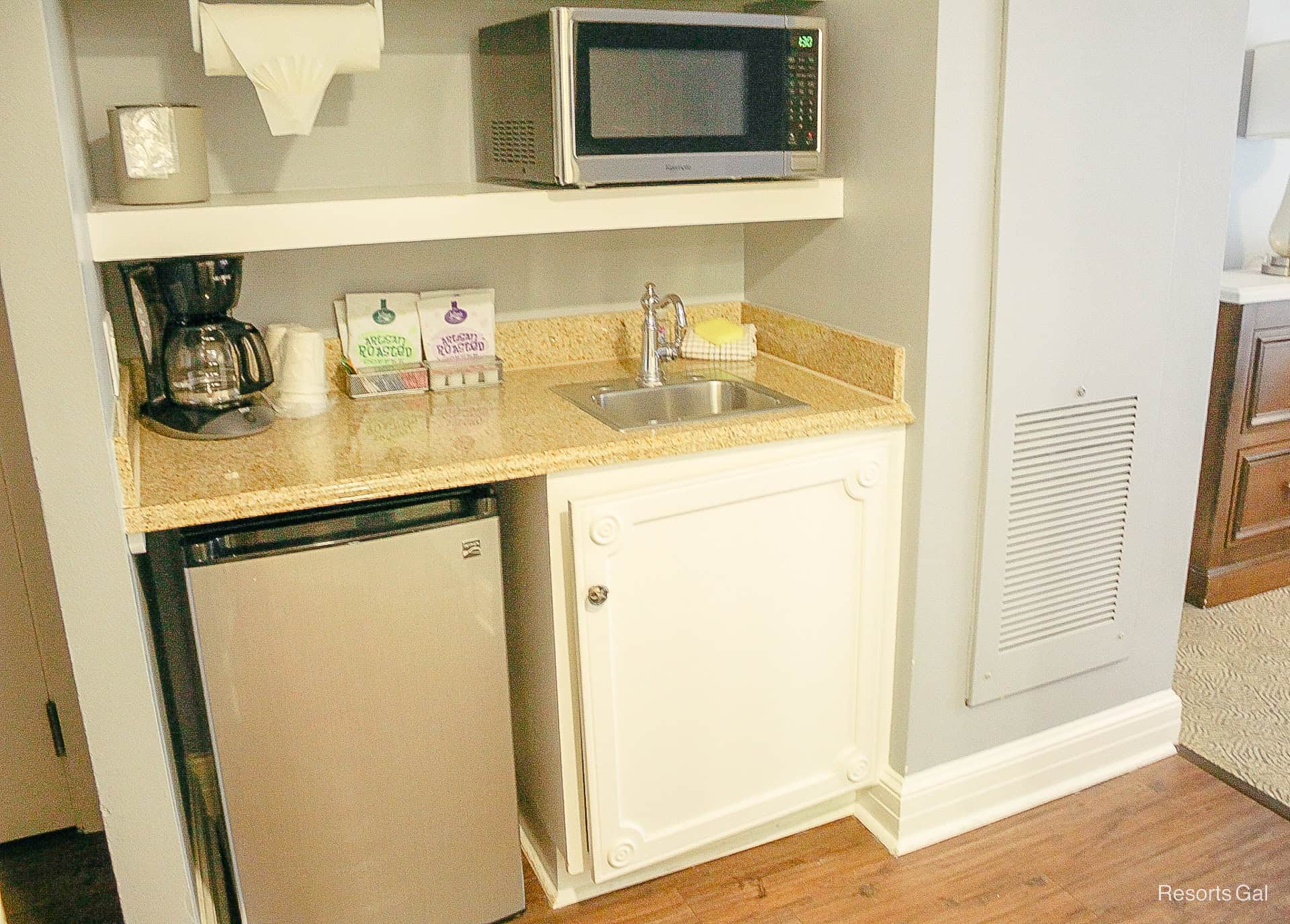 the kitchenette with a mini fridge, coffee-maker and other amenities 