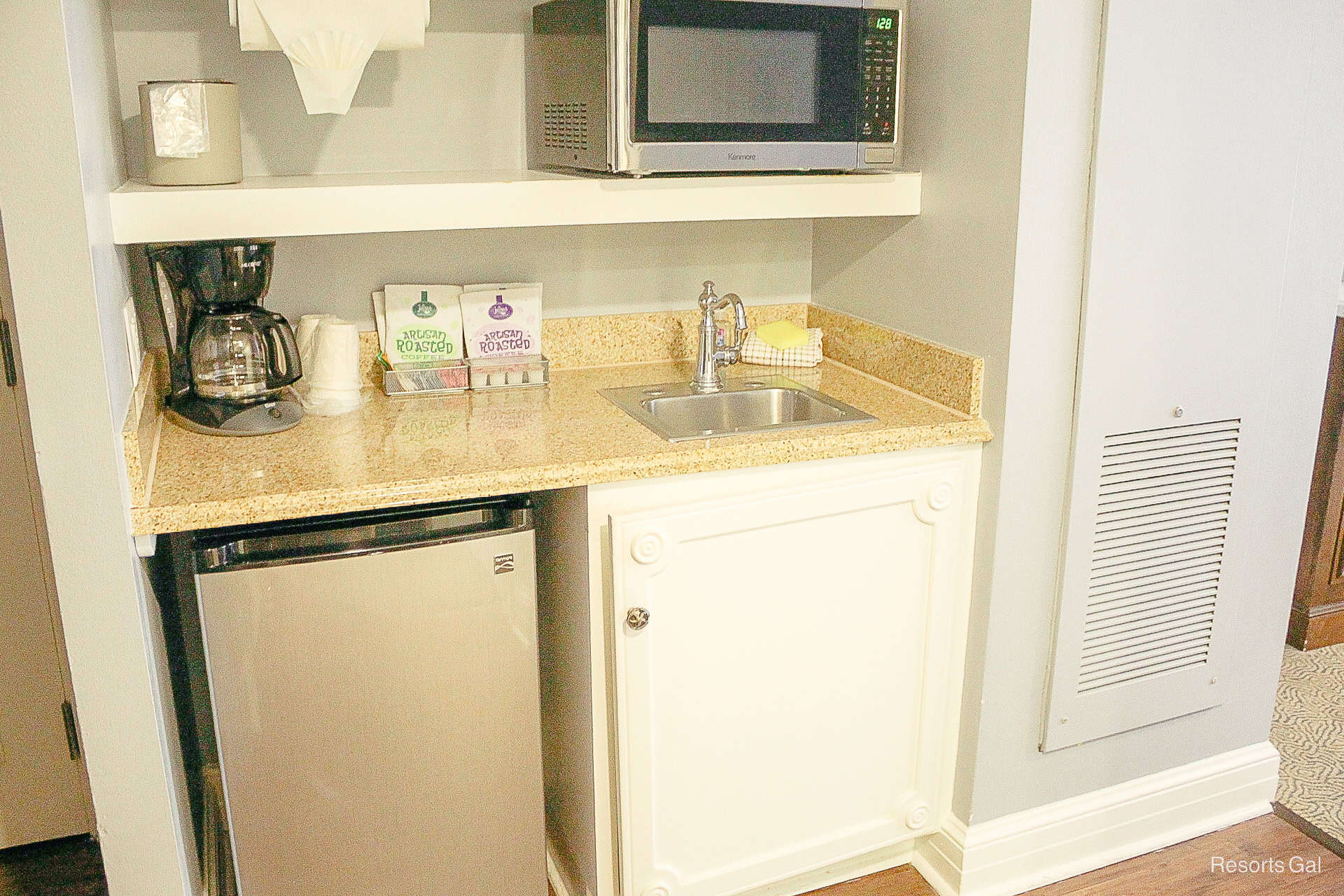 a closeup of the microwave and sink 