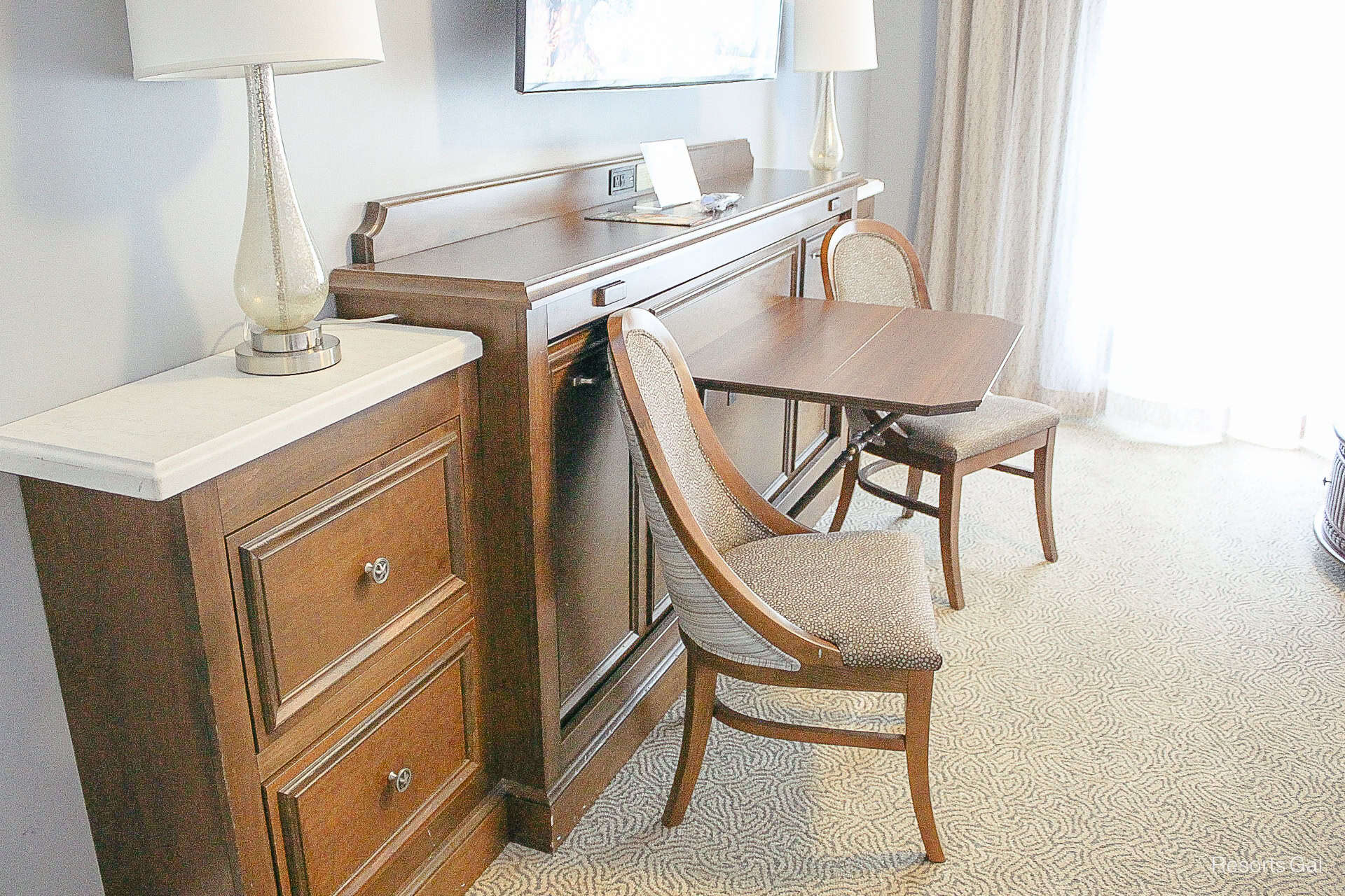 a table and chairs that folds to make a single size sleeper in a deluxe studio 