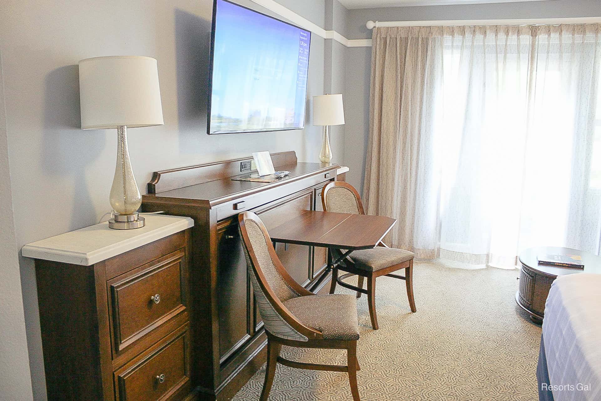 a table in chairs in a deluxe studio at Beach Club Villas 