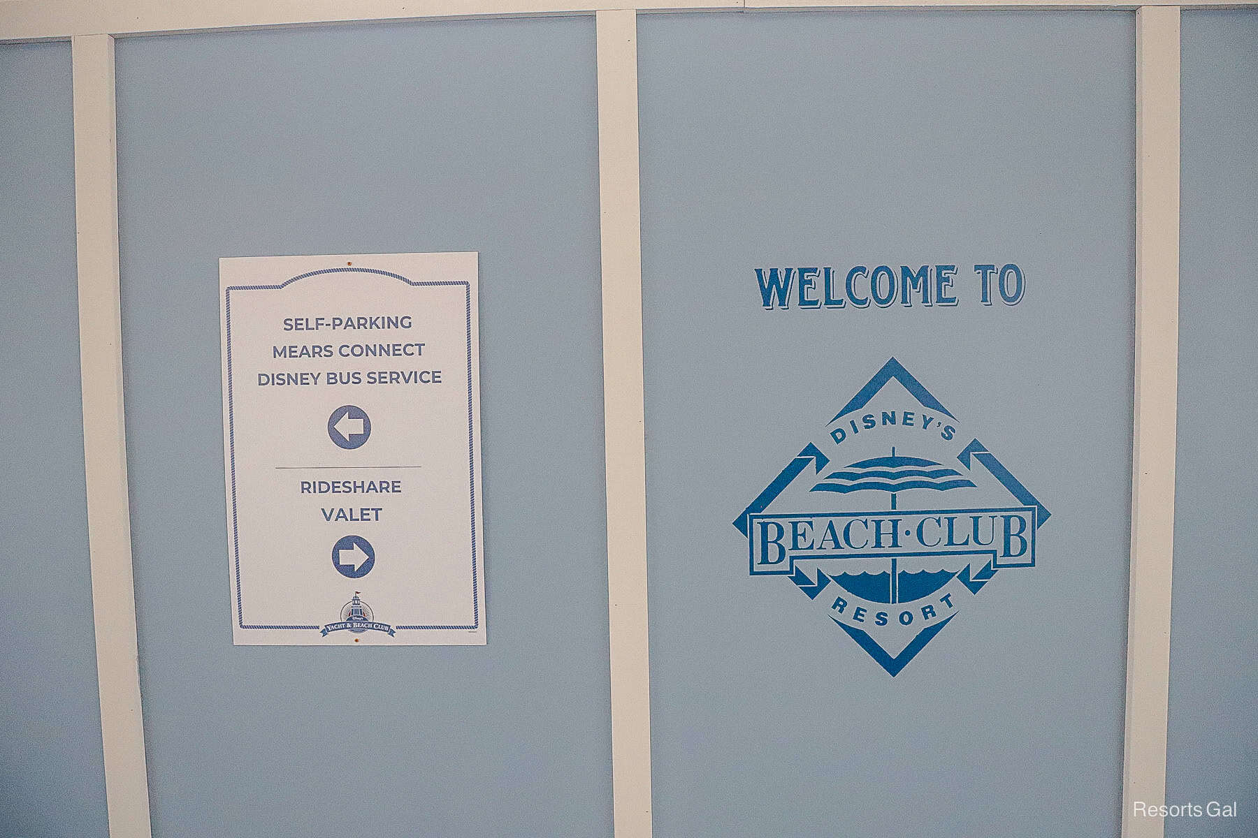 a sign on the construction wall that welcomes guests to Disneys Beach Club