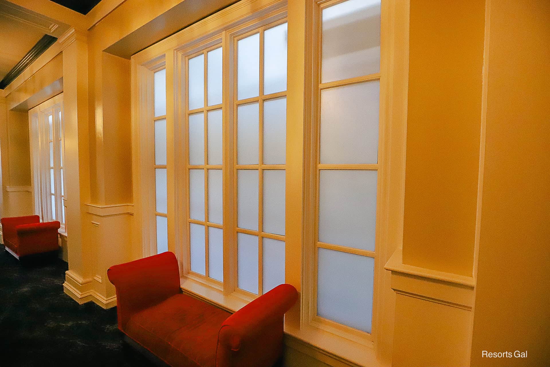 the windows in the hallway to the lobby are covered with frosted tint to block the construction views