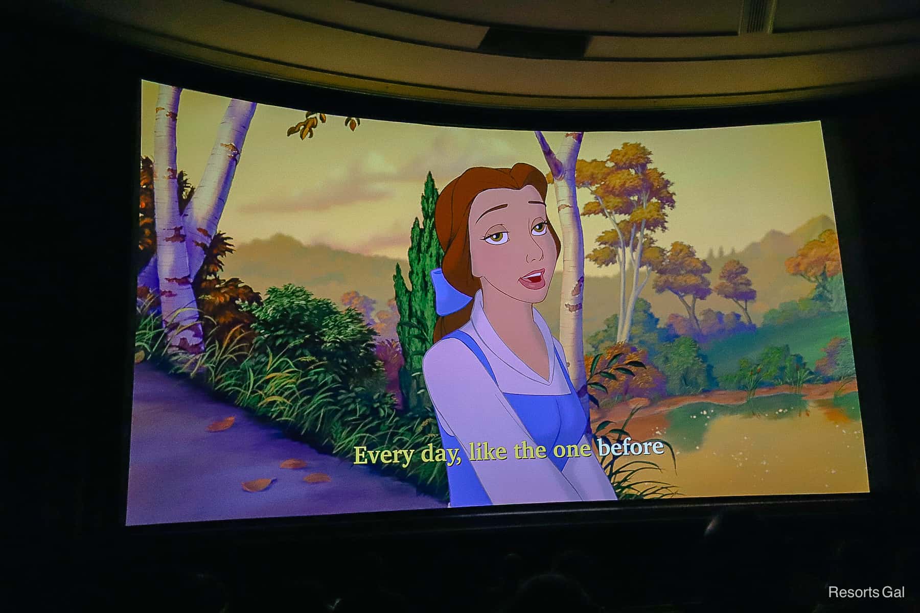 Sing Along lyrics on the screen "Every day, like the one before." Belle with mundane expression. 