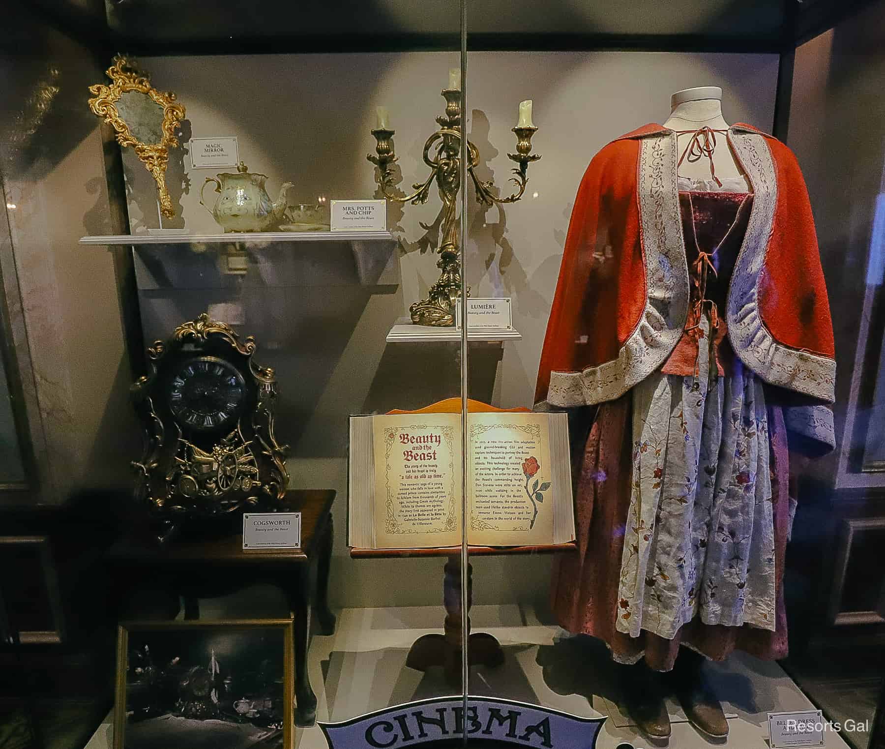 a display case of costumes and items that were used in the Live-Action Beauty and the Beast