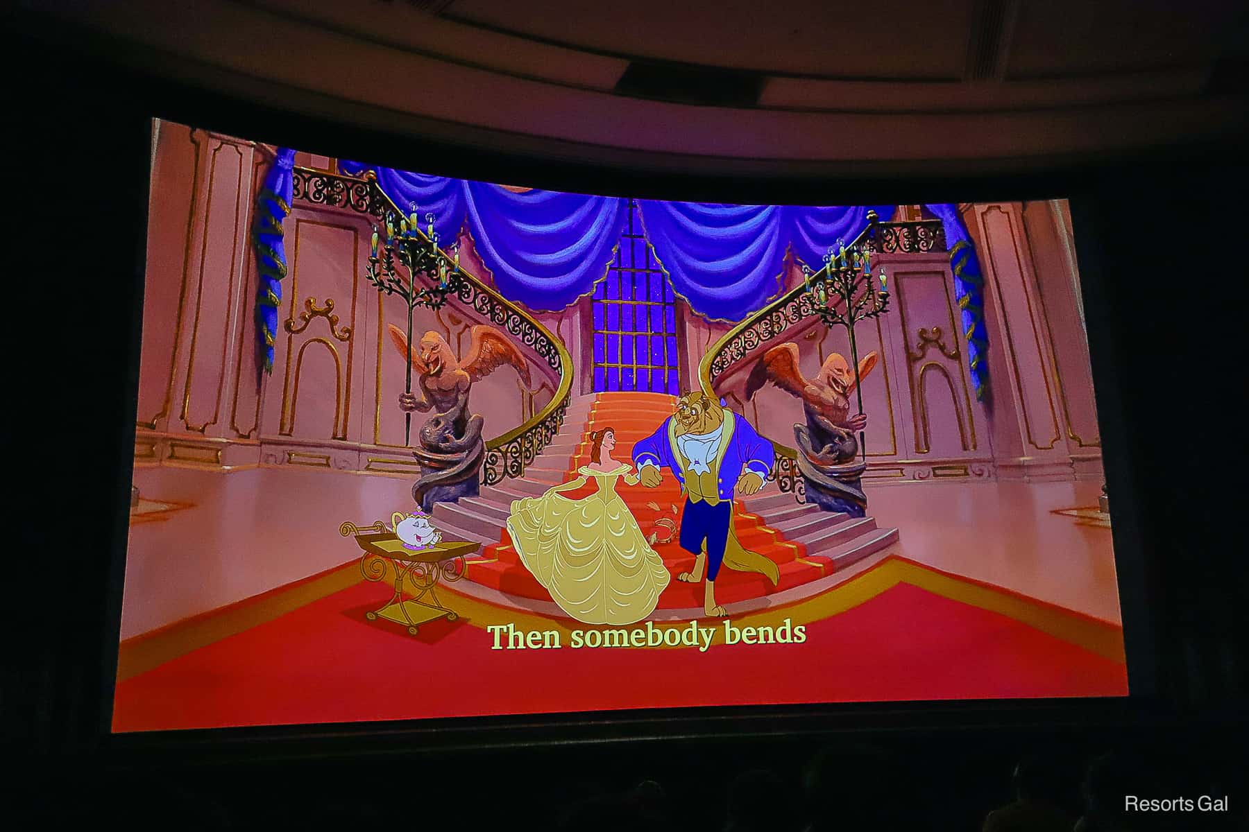 on screen lyrics read "Then somebody bends." 