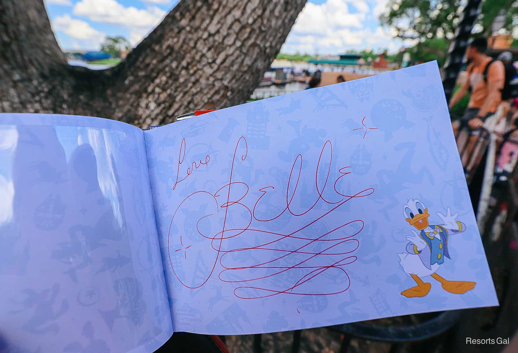Belle's signature in a character autograph book. 