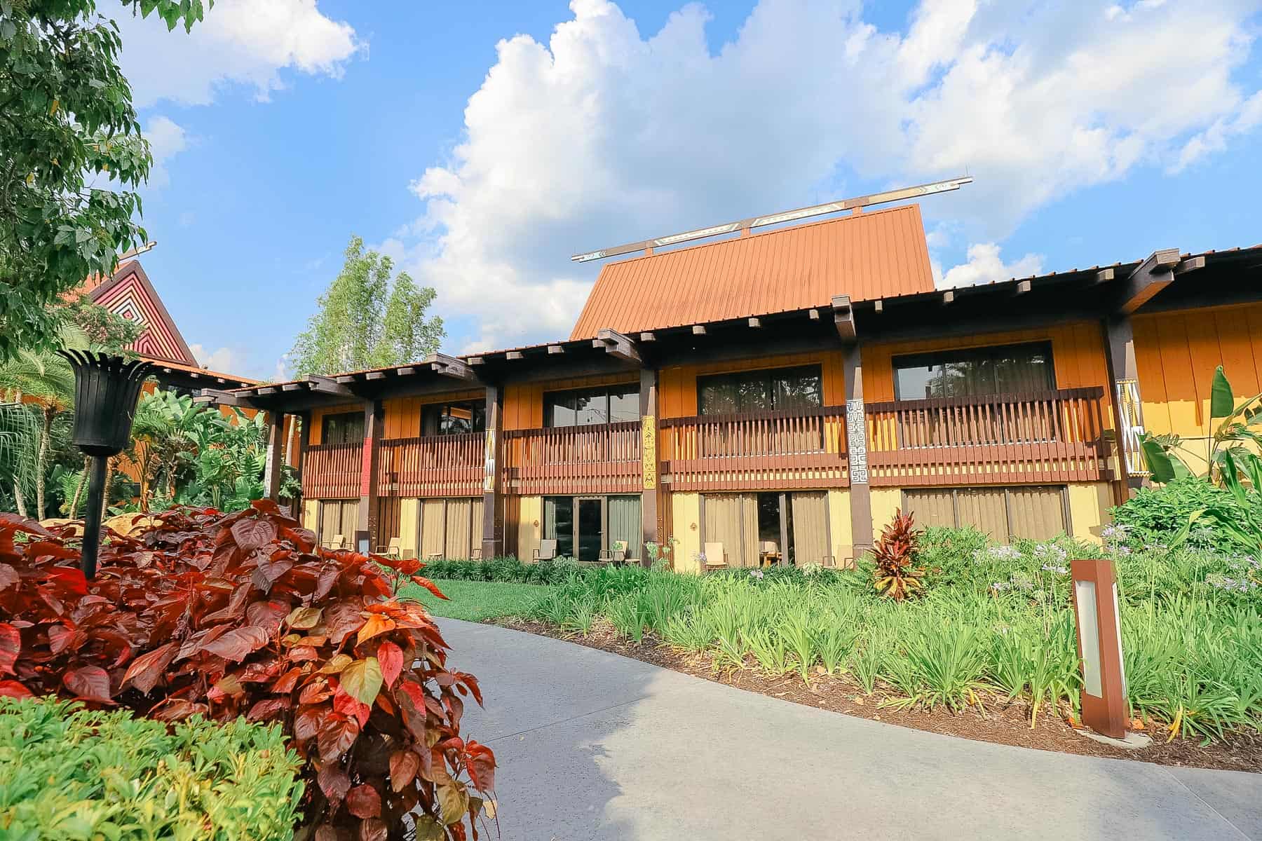 Disney's Polynesian Village Resort with blue skies and tropical landscaping